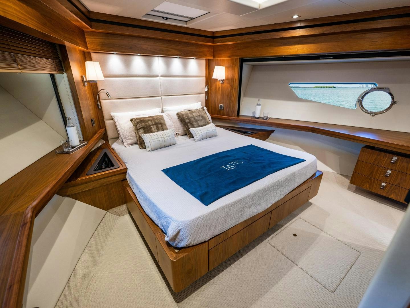a room with a bed and a window aboard TATIS Yacht for Sale