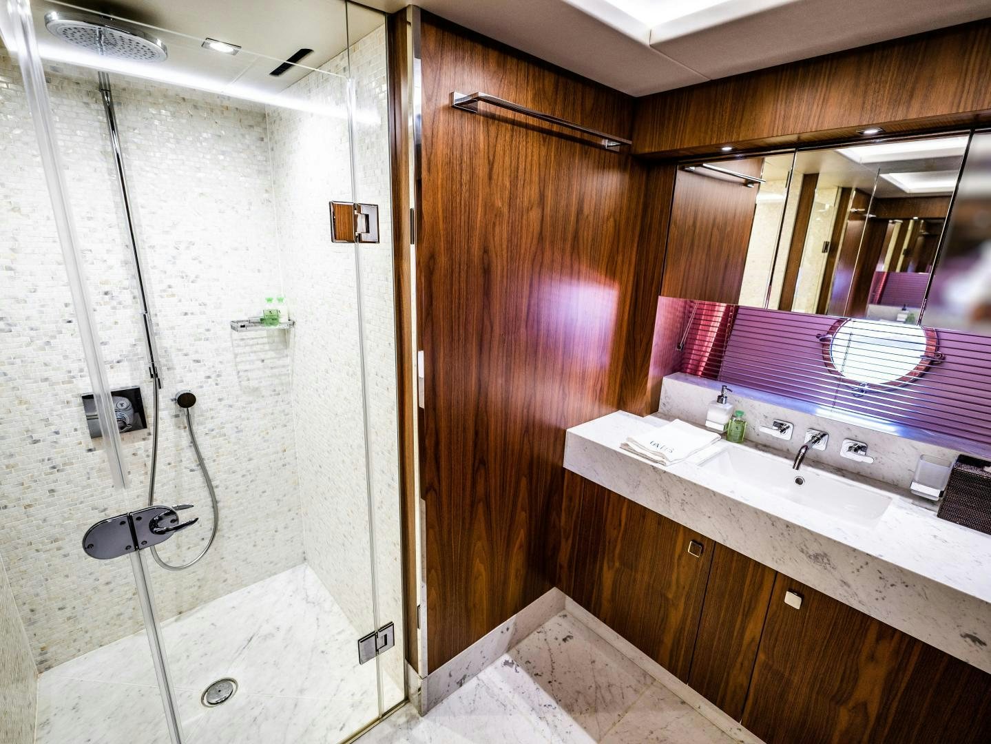 a bathroom with a sink and a shower aboard TATIS Yacht for Sale
