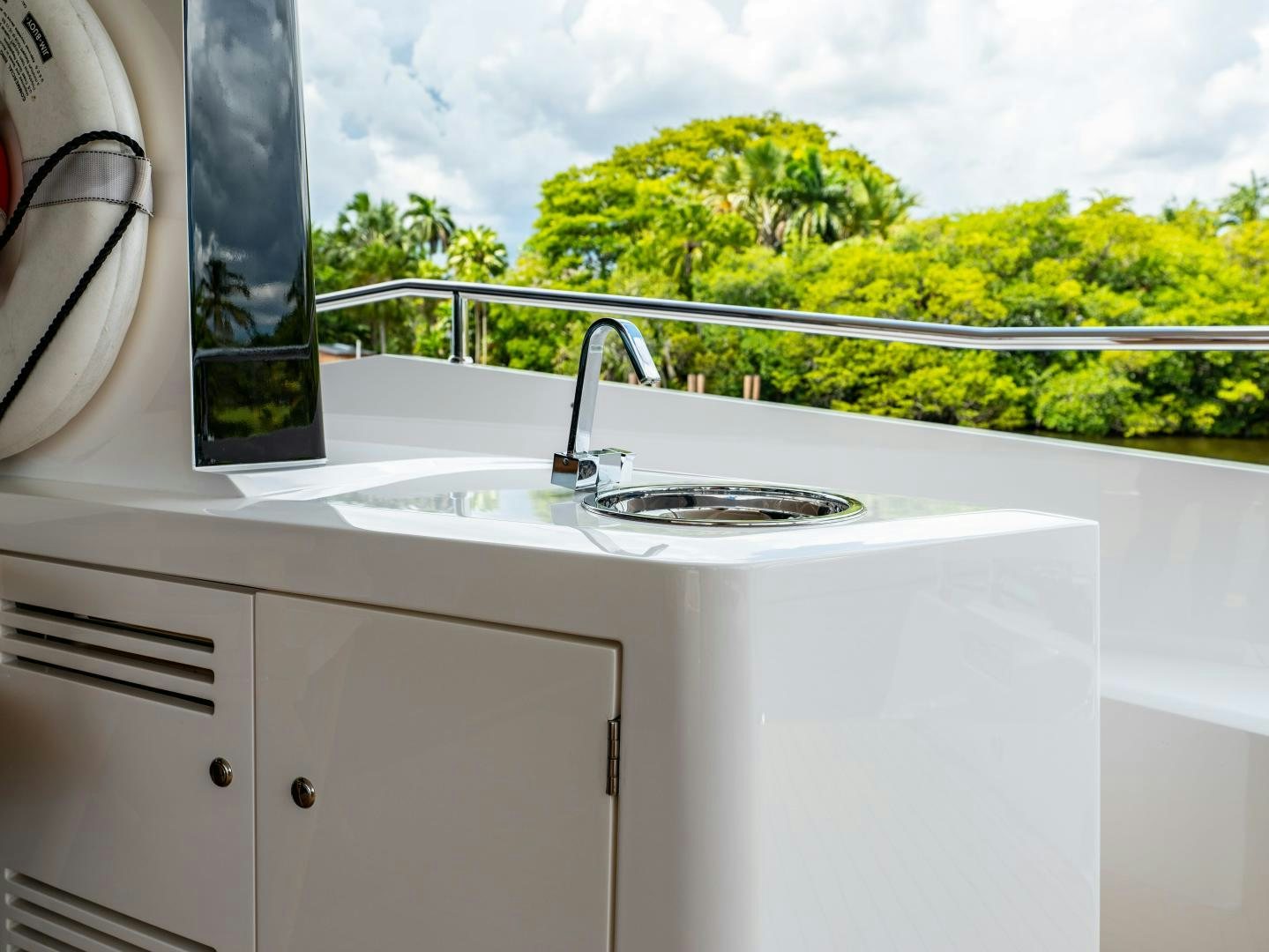 a sink with a tree in the background aboard TATIS Yacht for Sale