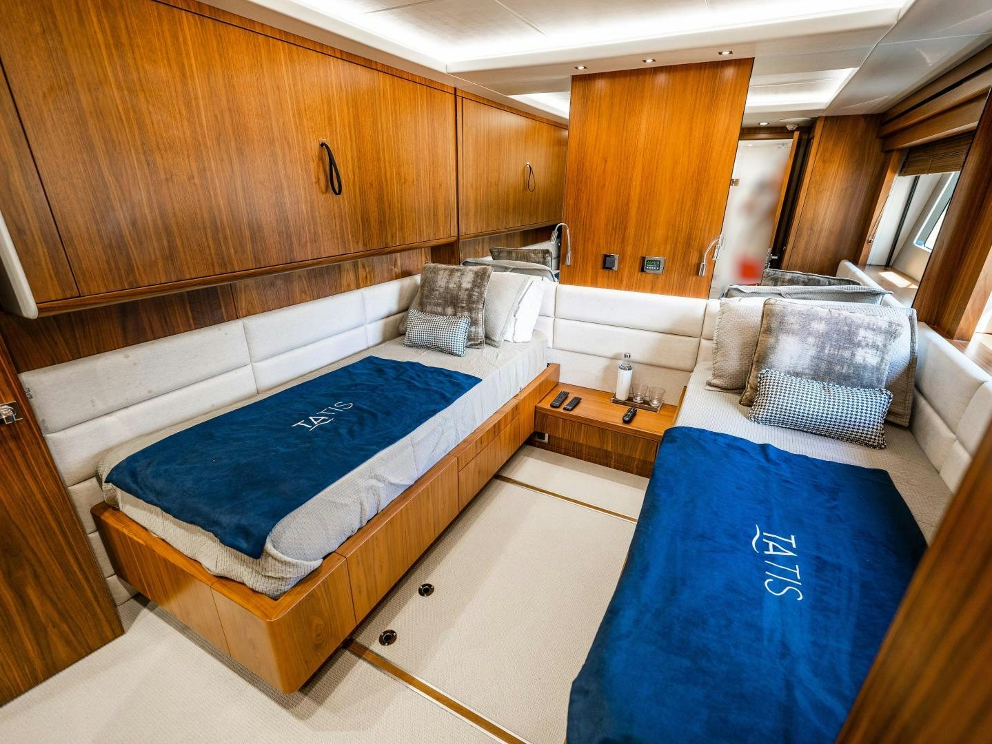 a room with a couple of beds aboard TATIS Yacht for Sale