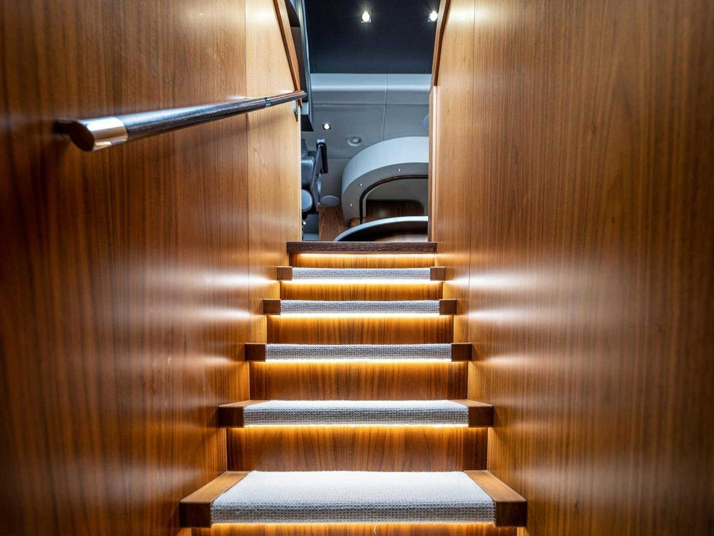 a staircase with a metal railing aboard TATIS Yacht for Sale