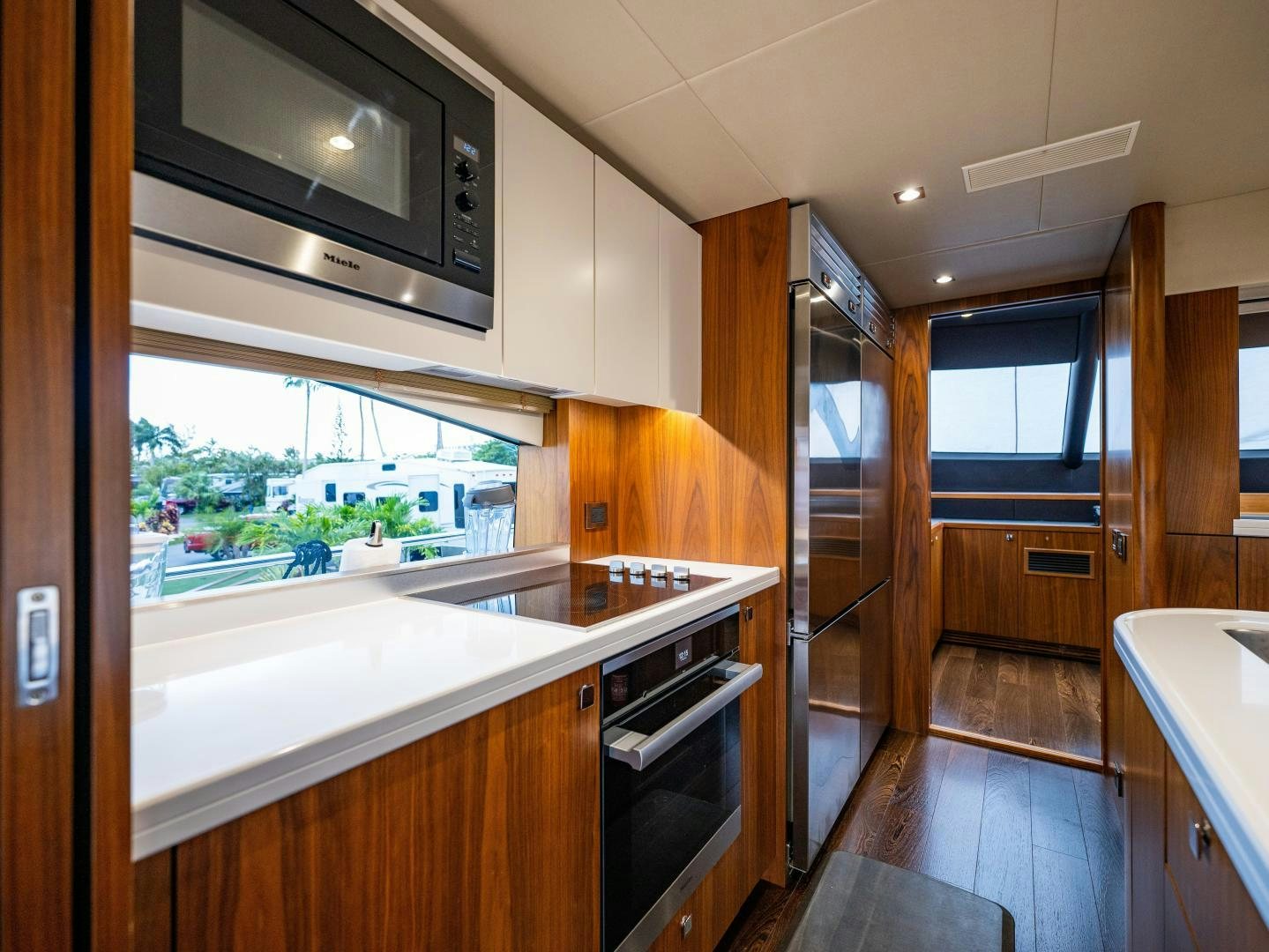 a kitchen with a large window aboard TATIS Yacht for Sale
