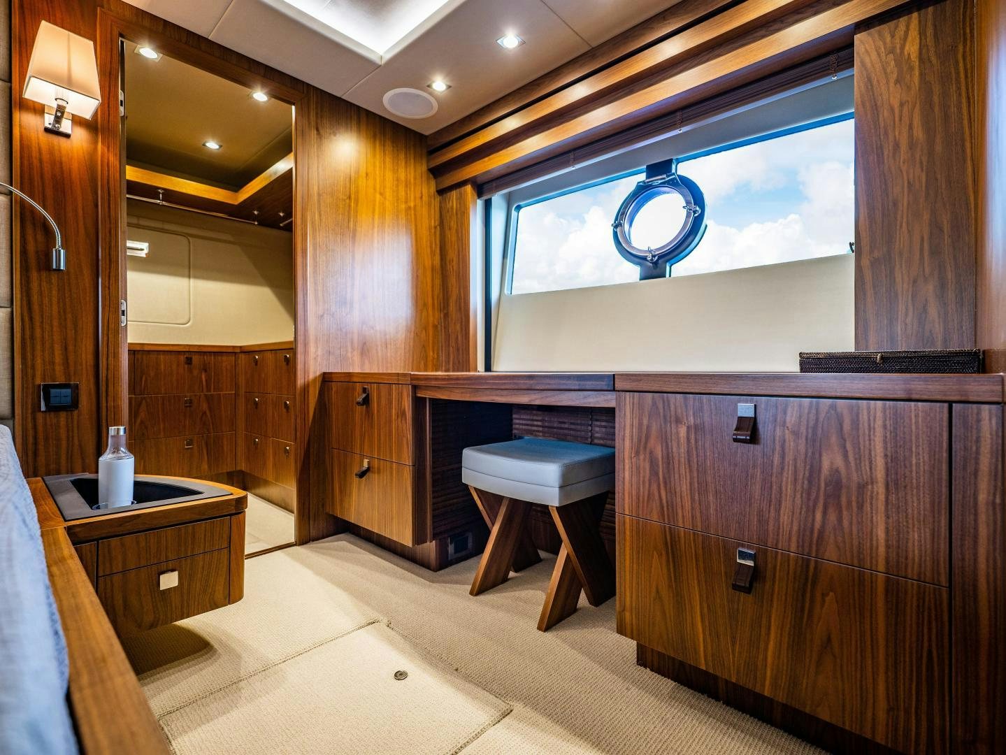 a room with wooden cabinets and a large window aboard TATIS Yacht for Sale