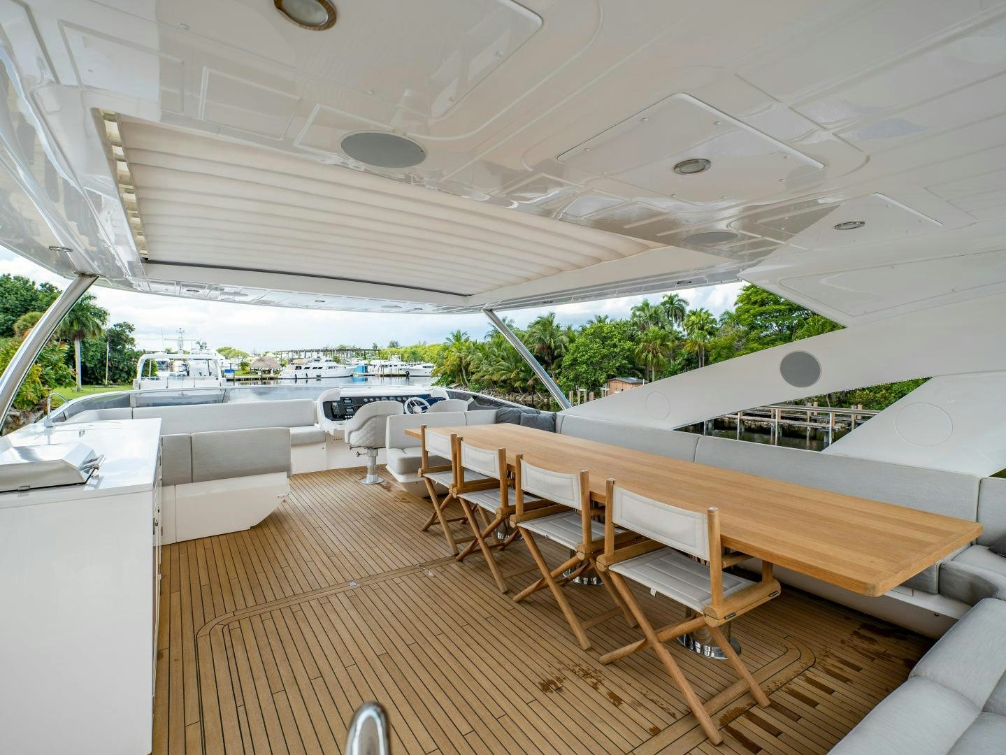 a room with tables and chairs aboard TATIS Yacht for Sale