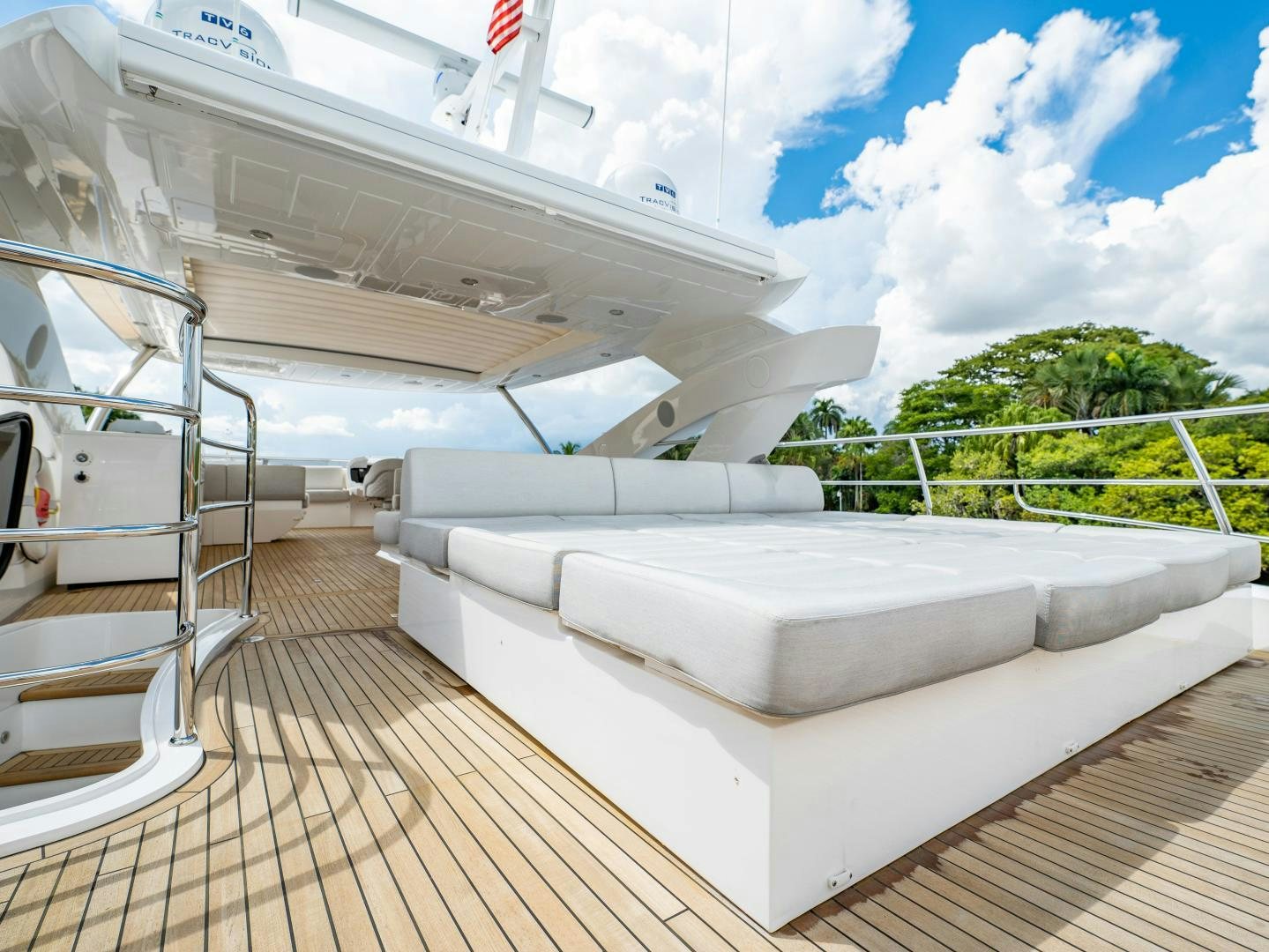 a white couch on a deck aboard TATIS Yacht for Sale