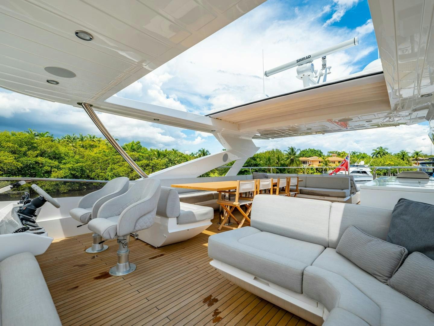 a room with a couch and a table and chairs aboard TATIS Yacht for Sale
