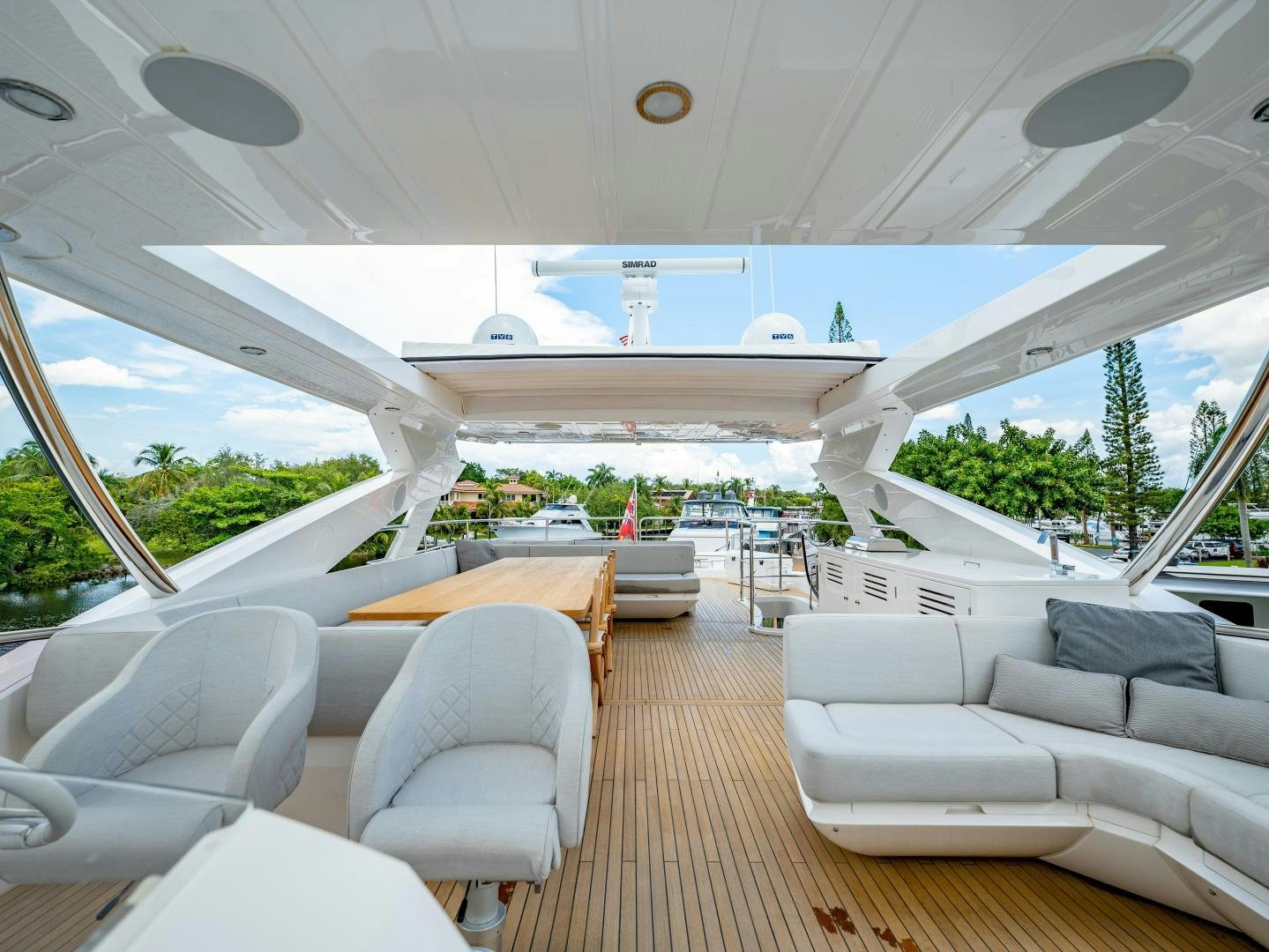 a room with a couch and a table and chairs aboard TATIS Yacht for Sale