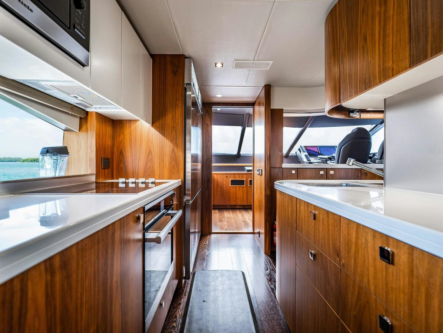 a kitchen with wooden cabinets aboard TATIS Yacht for Sale