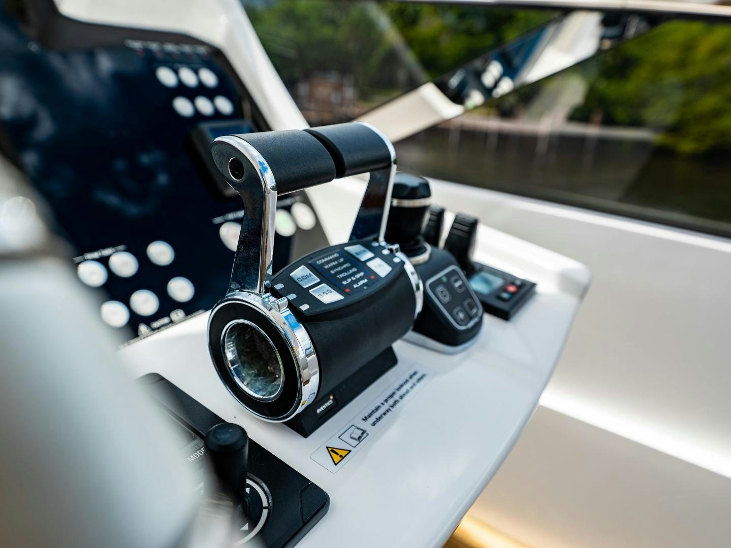 a steering wheel and dashboard of a car aboard TATIS Yacht for Sale