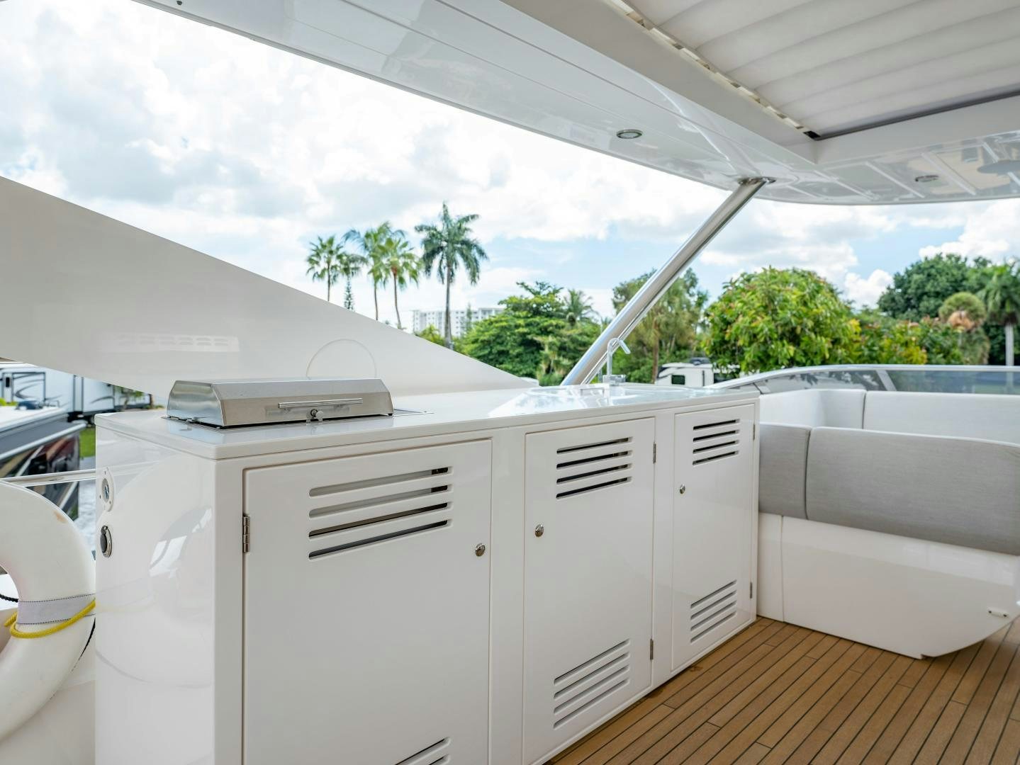 a white kitchen with white cabinets aboard TATIS Yacht for Sale