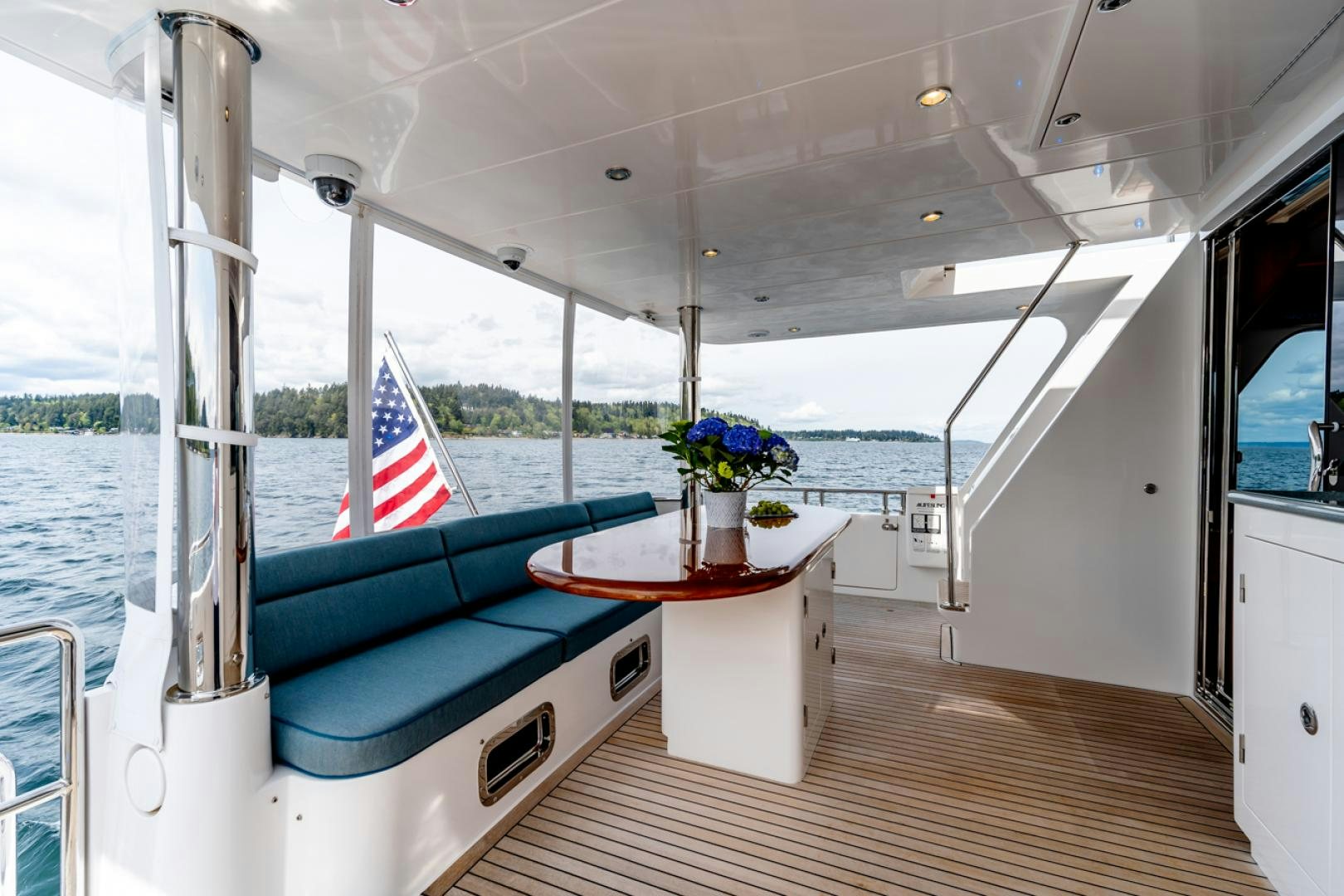 a boat with a flag on the deck aboard MAHALO Yacht for Sale