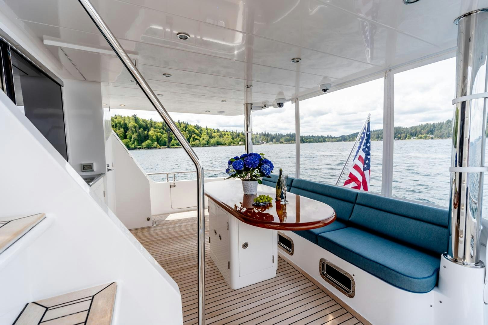 a boat with a table and a flag on it aboard MAHALO Yacht for Sale