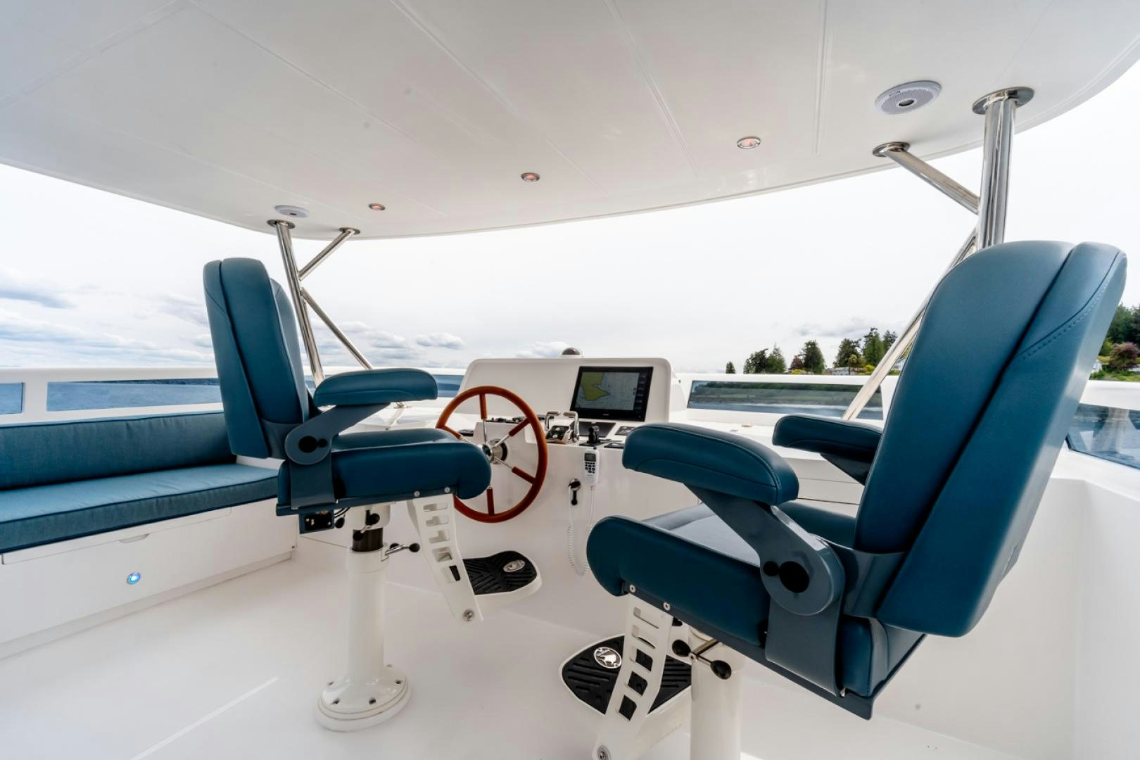 a blue chair on a boat aboard MAHALO Yacht for Sale