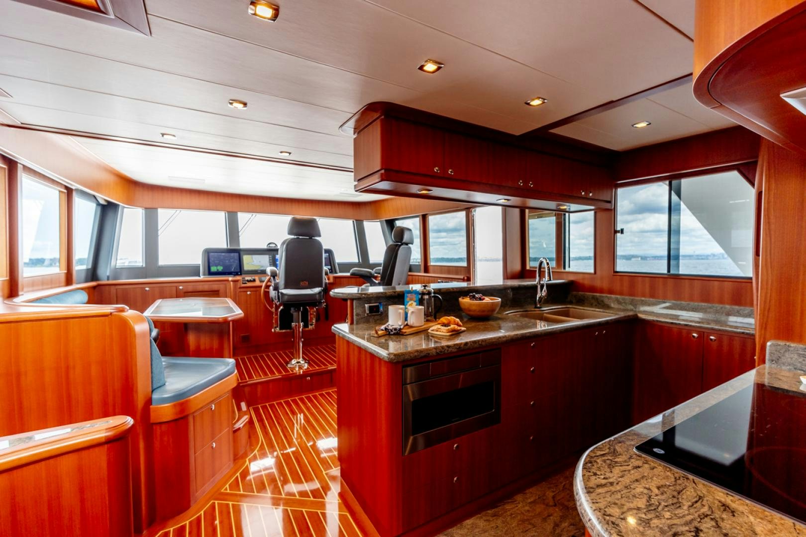 a kitchen with a bar and a bar aboard MAHALO Yacht for Sale