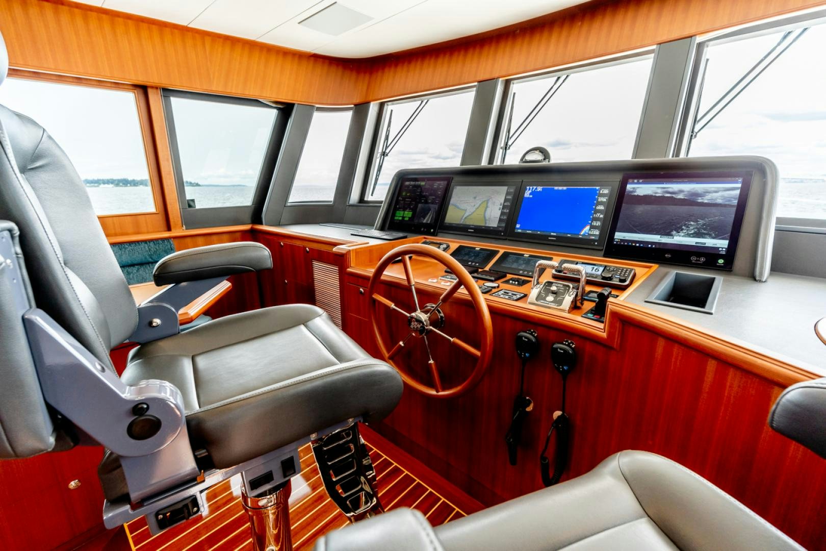 inside of a vehicle with a steering wheel and seats aboard MAHALO Yacht for Sale