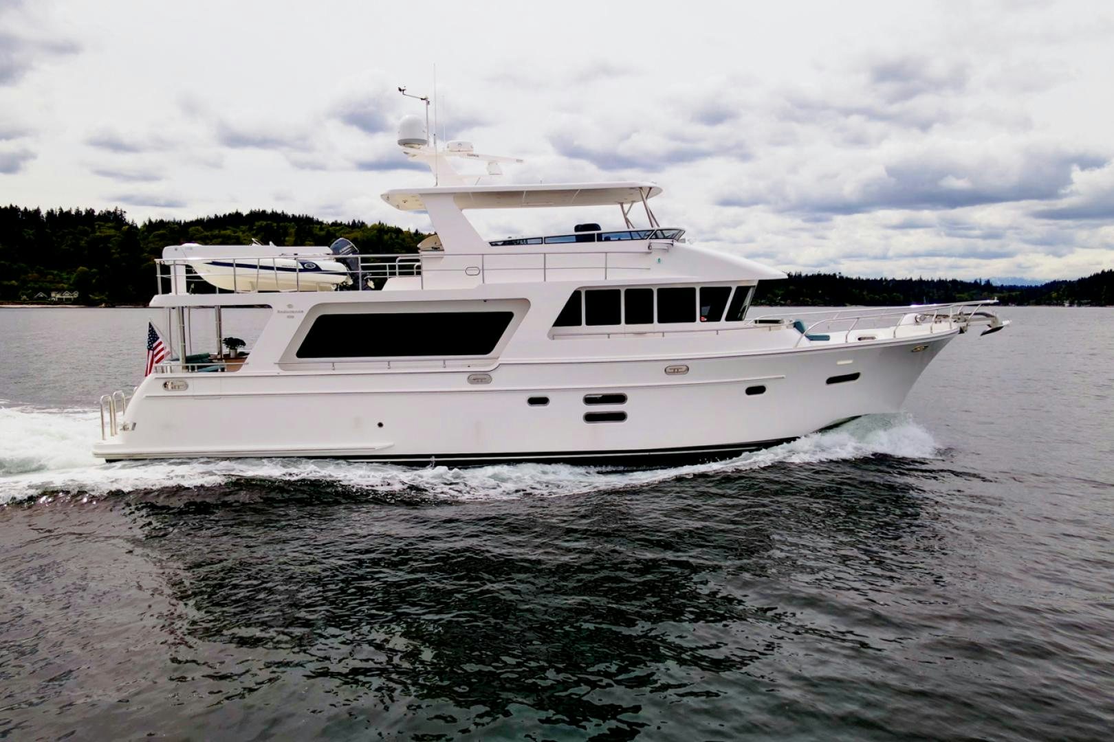 a white boat on the water aboard MAHALO Yacht for Sale