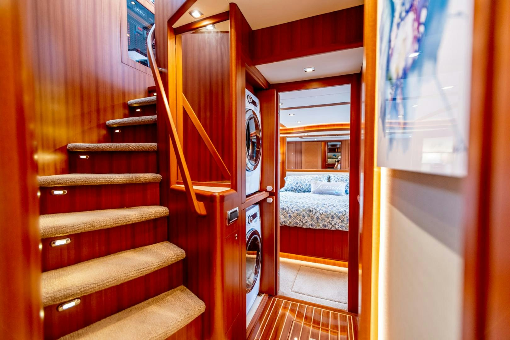 a room with a bunk bed and a red door aboard MAHALO Yacht for Sale