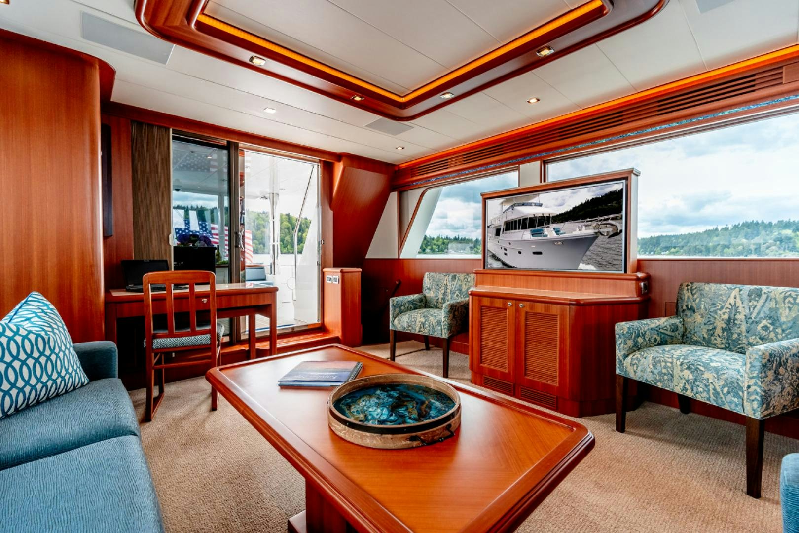 a living room with a large window aboard MAHALO Yacht for Sale