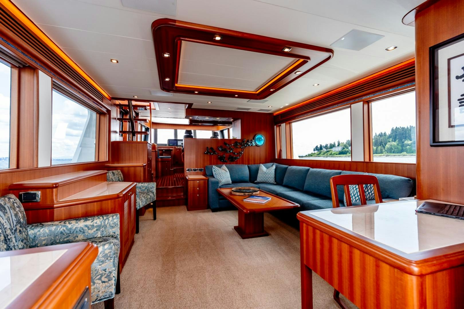 a living room with a couch and a table aboard MAHALO Yacht for Sale