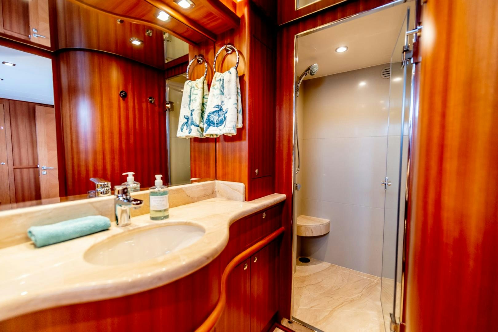 a bathroom with red walls aboard MAHALO Yacht for Sale