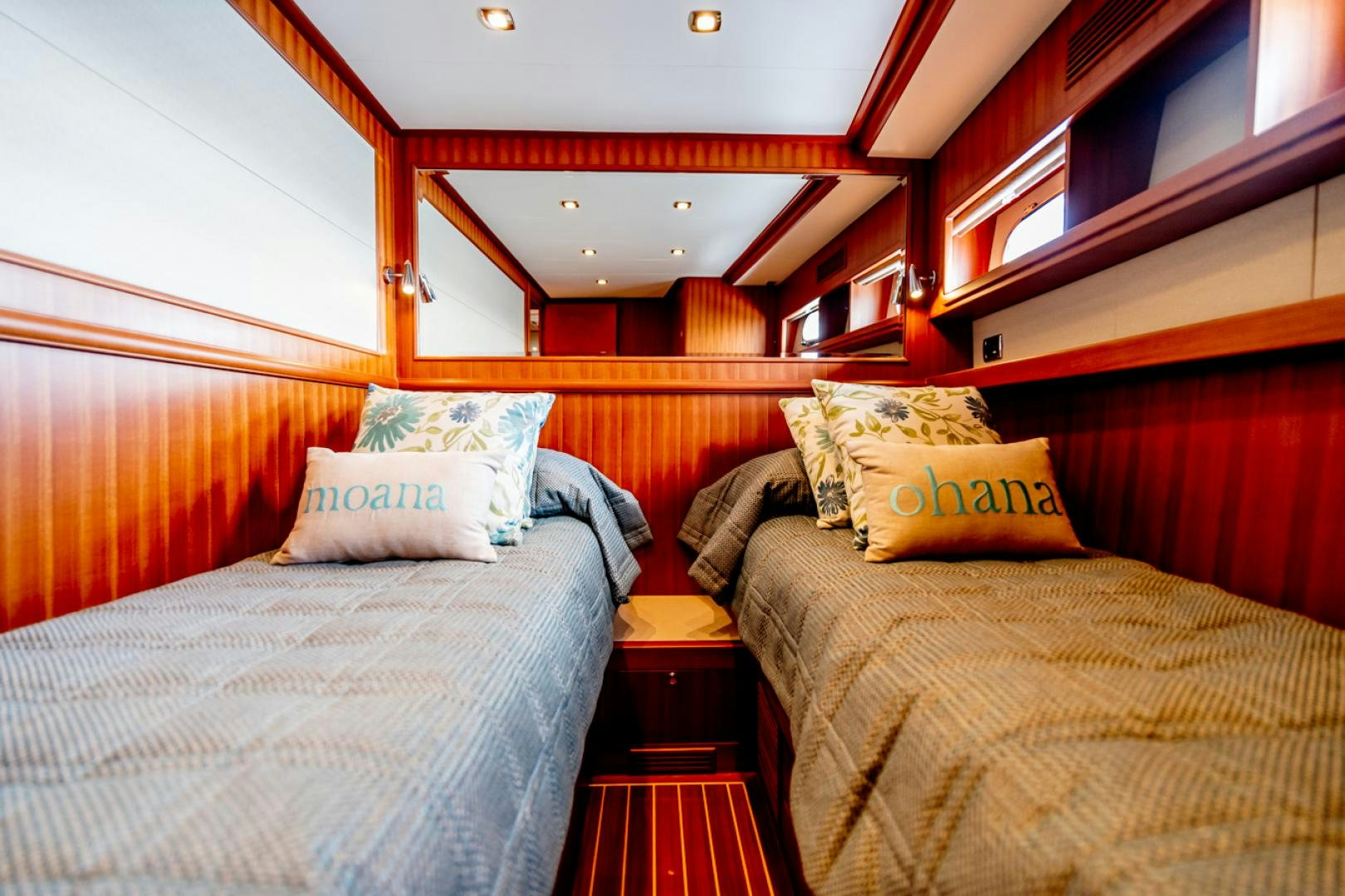 a room with beds and a window aboard MAHALO Yacht for Sale
