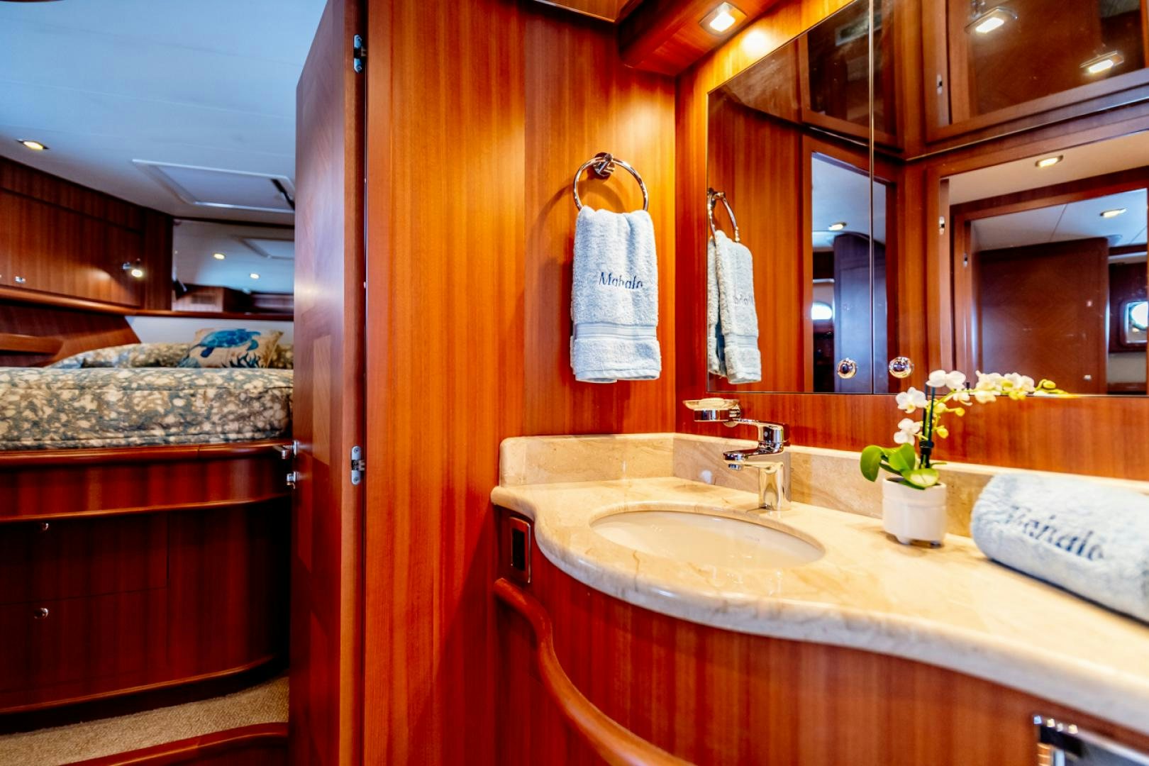 a bathroom with a sink and a mirror aboard MAHALO Yacht for Sale