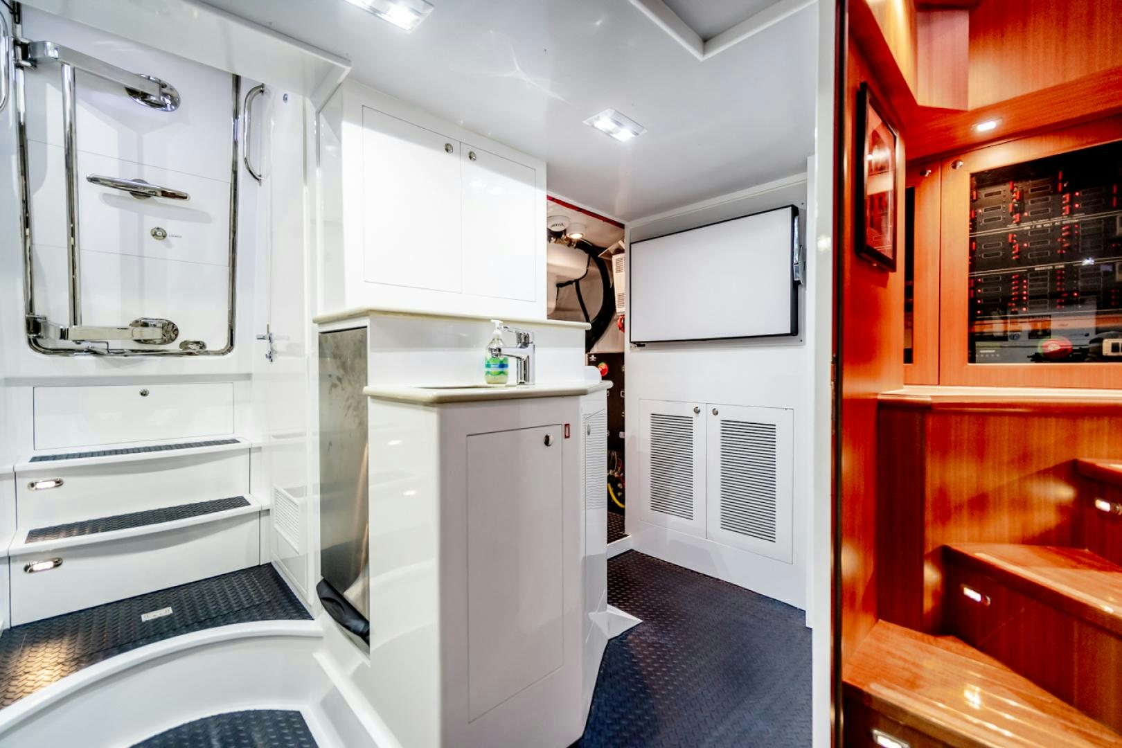 a room with a closet and a bed aboard MAHALO Yacht for Sale