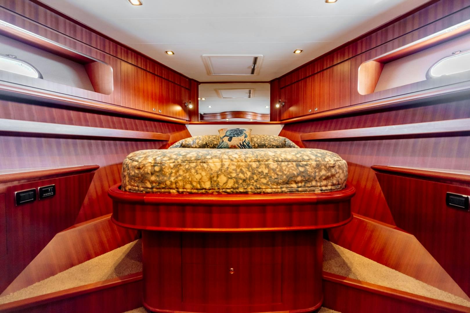 a room with a bed and a couch aboard MAHALO Yacht for Sale