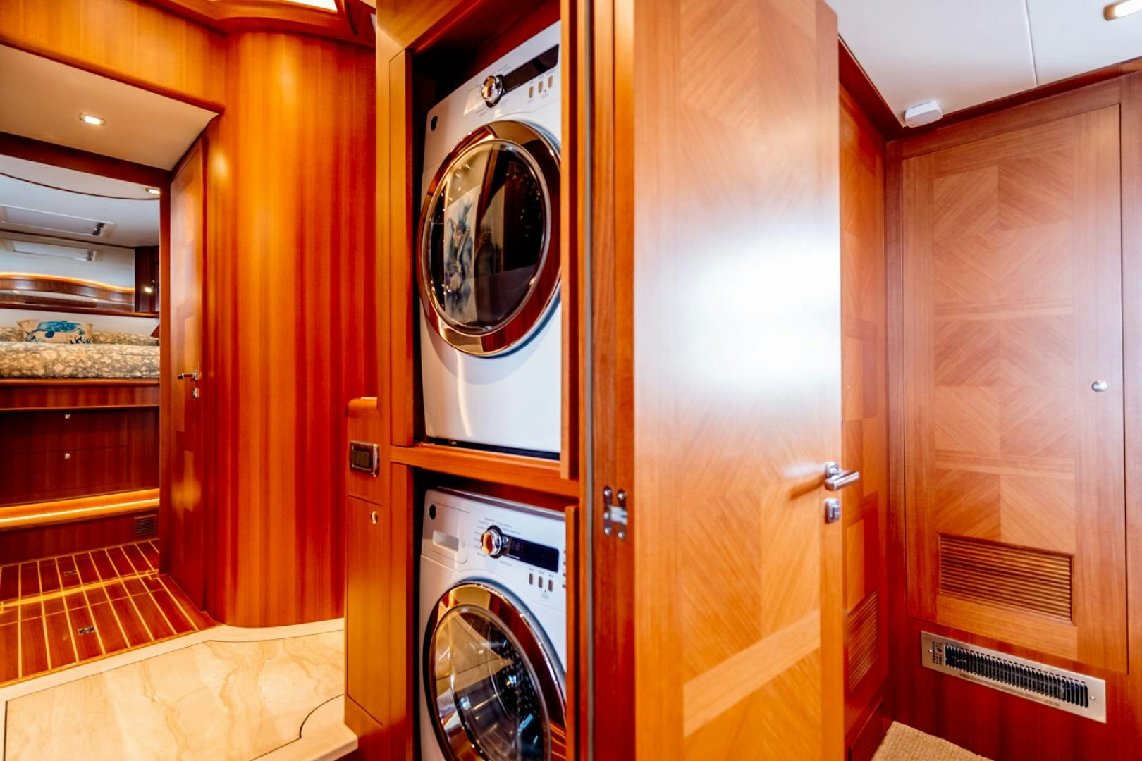 a door with a washing machine aboard MAHALO Yacht for Sale