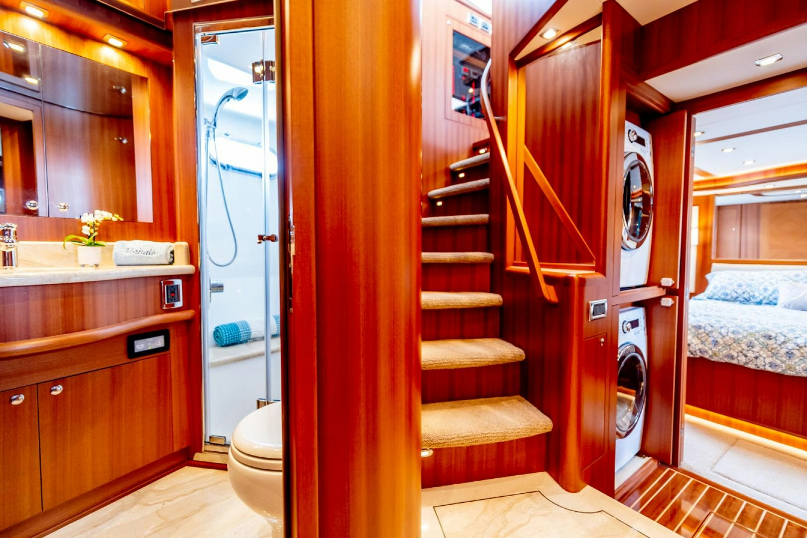 a room with a bed and a closet aboard MAHALO Yacht for Sale
