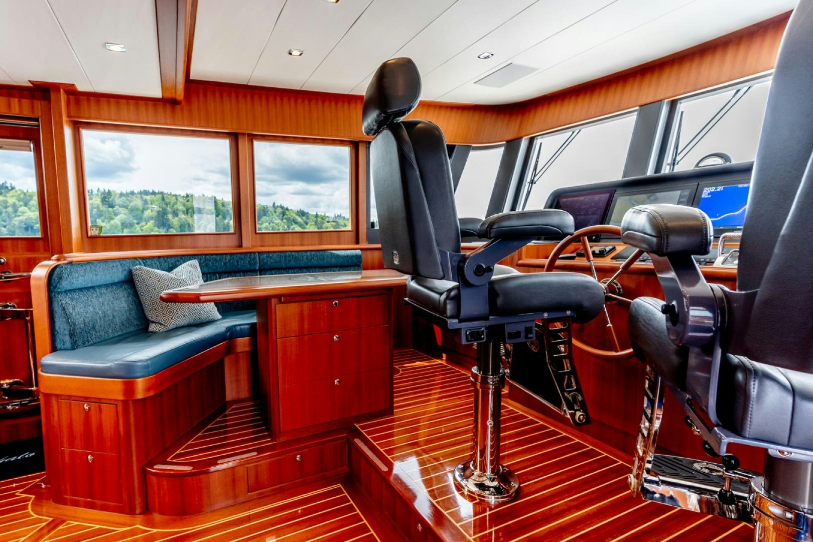 a bus with seats and desks aboard MAHALO Yacht for Sale