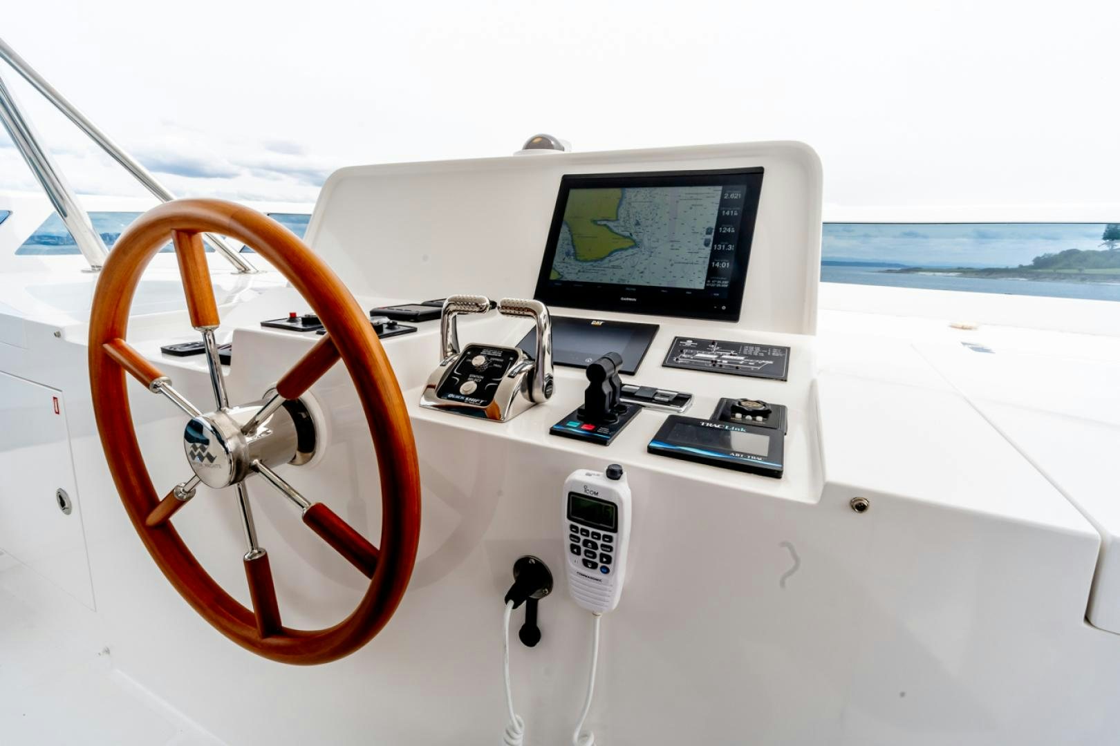 a steering wheel and a control panel on a boat aboard MAHALO Yacht for Sale
