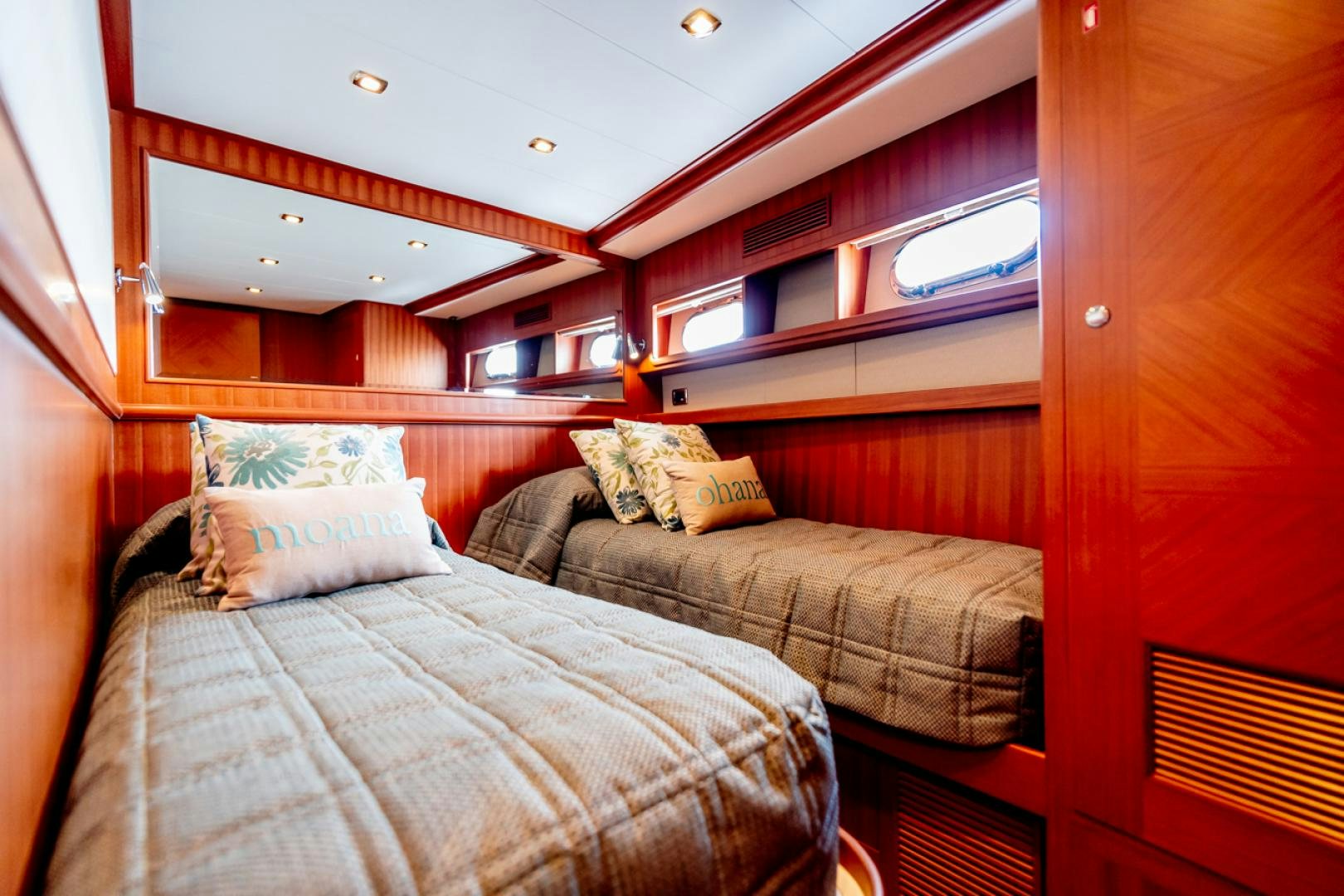 a room with a bed and a window aboard MAHALO Yacht for Sale