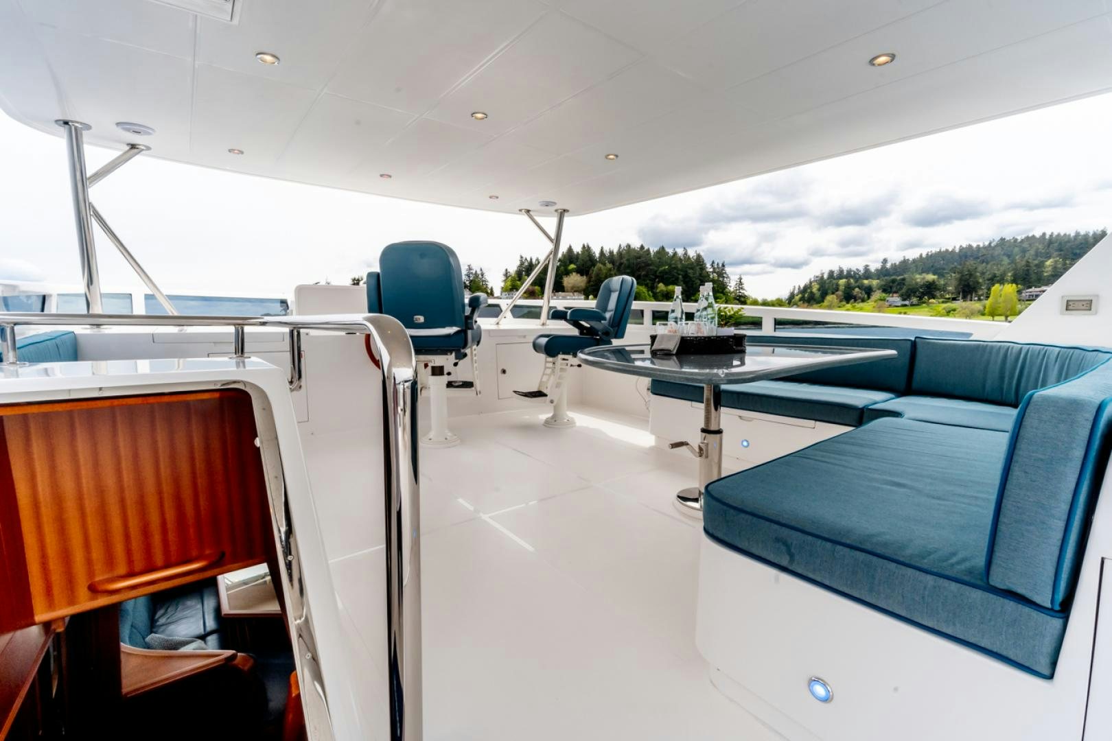 a room with a table and chairs aboard MAHALO Yacht for Sale