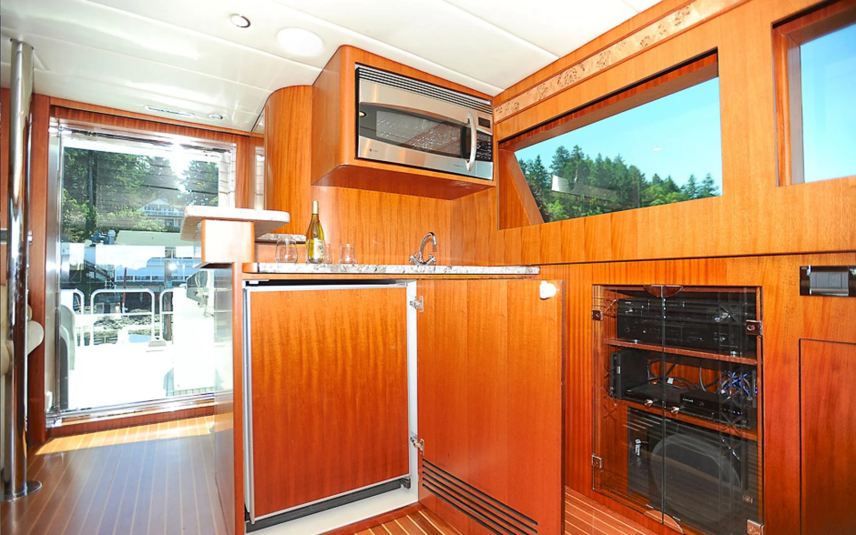 a kitchen with wooden cabinets aboard MARANATHA Yacht for Sale