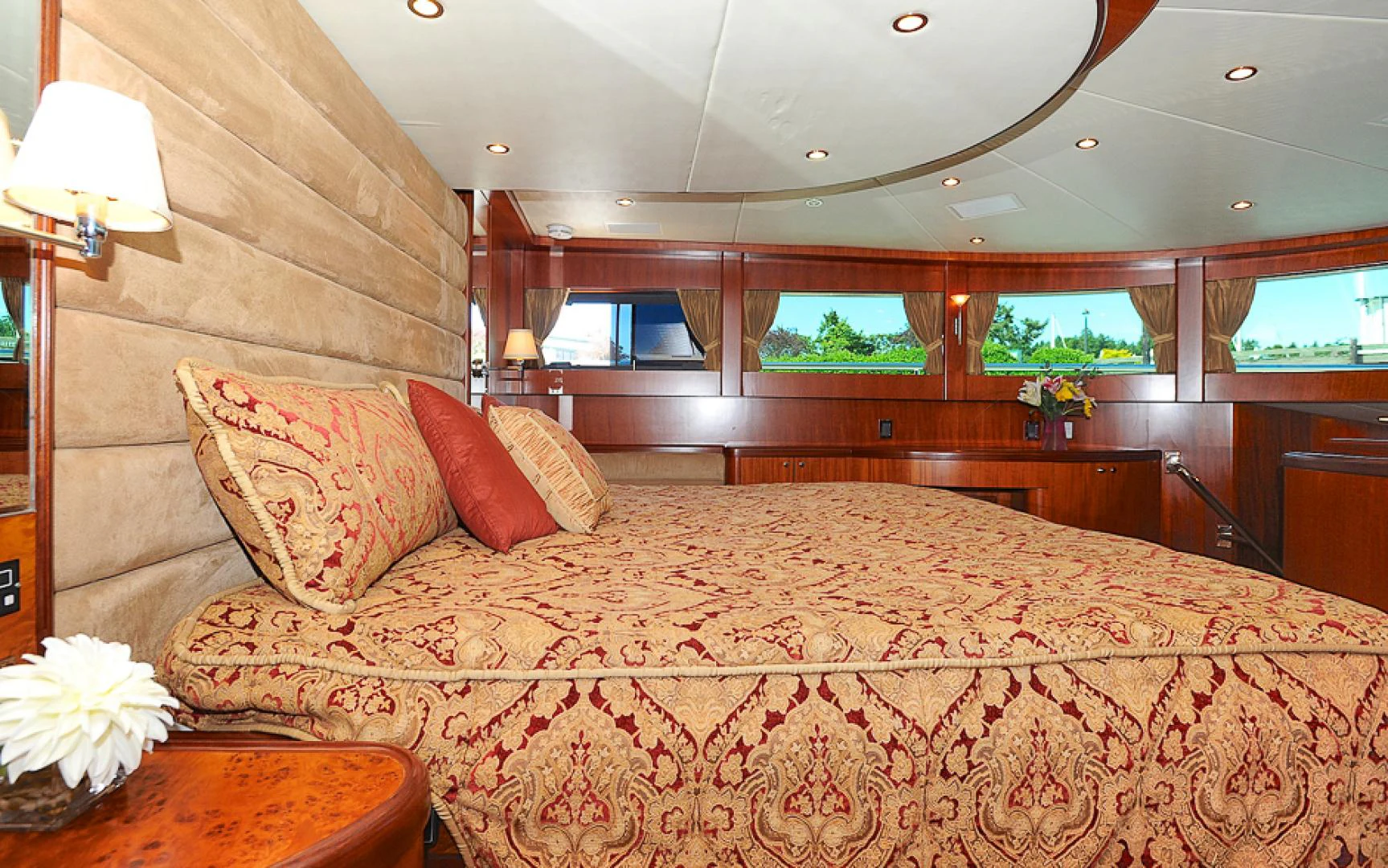 a large bed with a large wooden headboard aboard MARANATHA Yacht for Sale