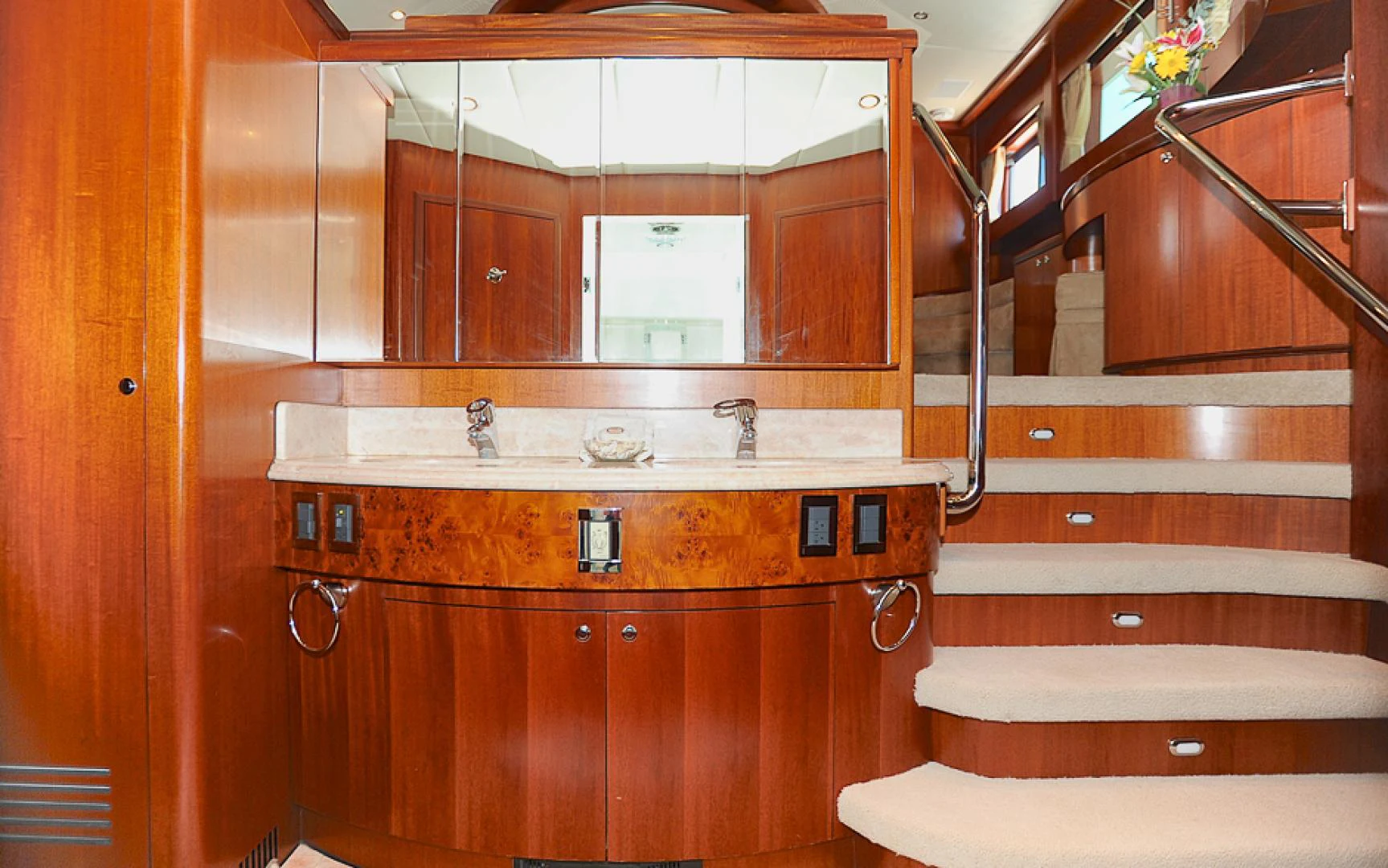 a kitchen with wooden cabinets aboard MARANATHA Yacht for Sale