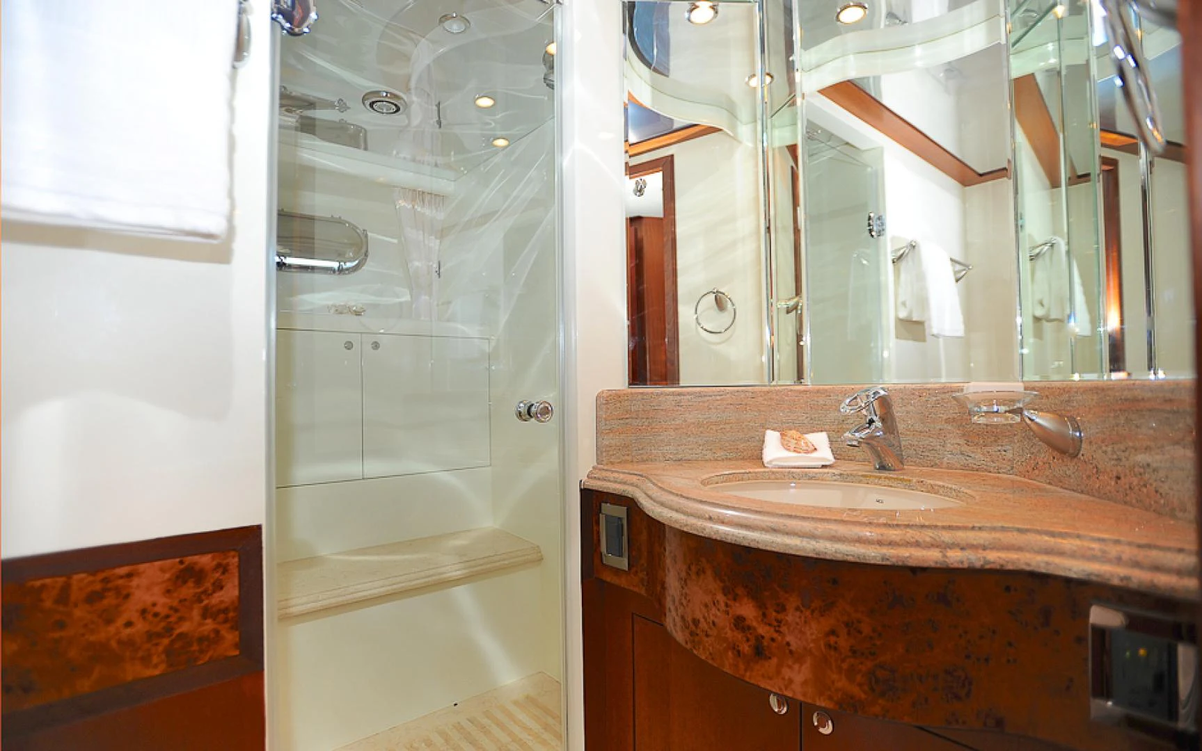 a bathroom with a large mirror aboard MARANATHA Yacht for Sale