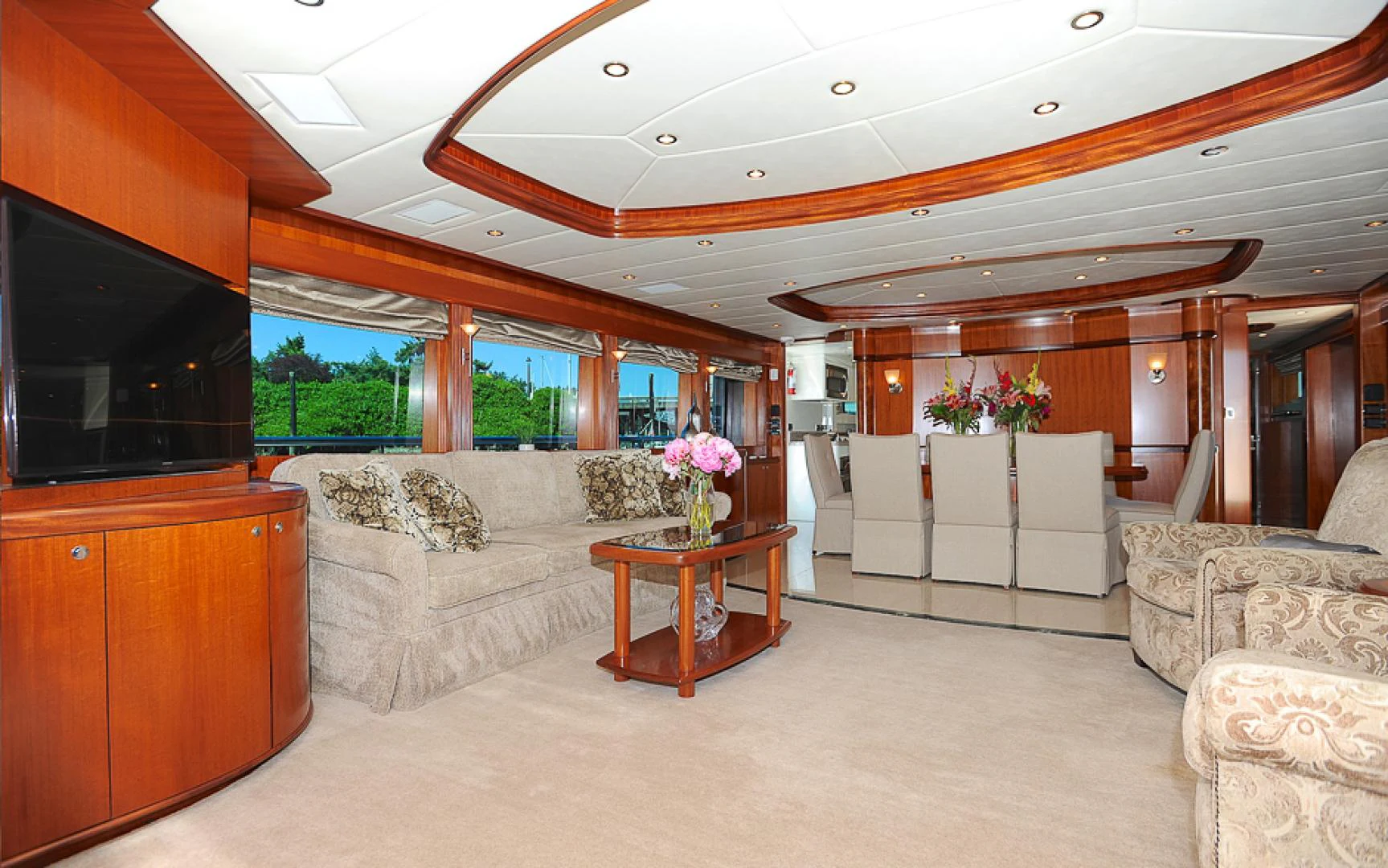a living room with a large sofa aboard MARANATHA Yacht for Sale
