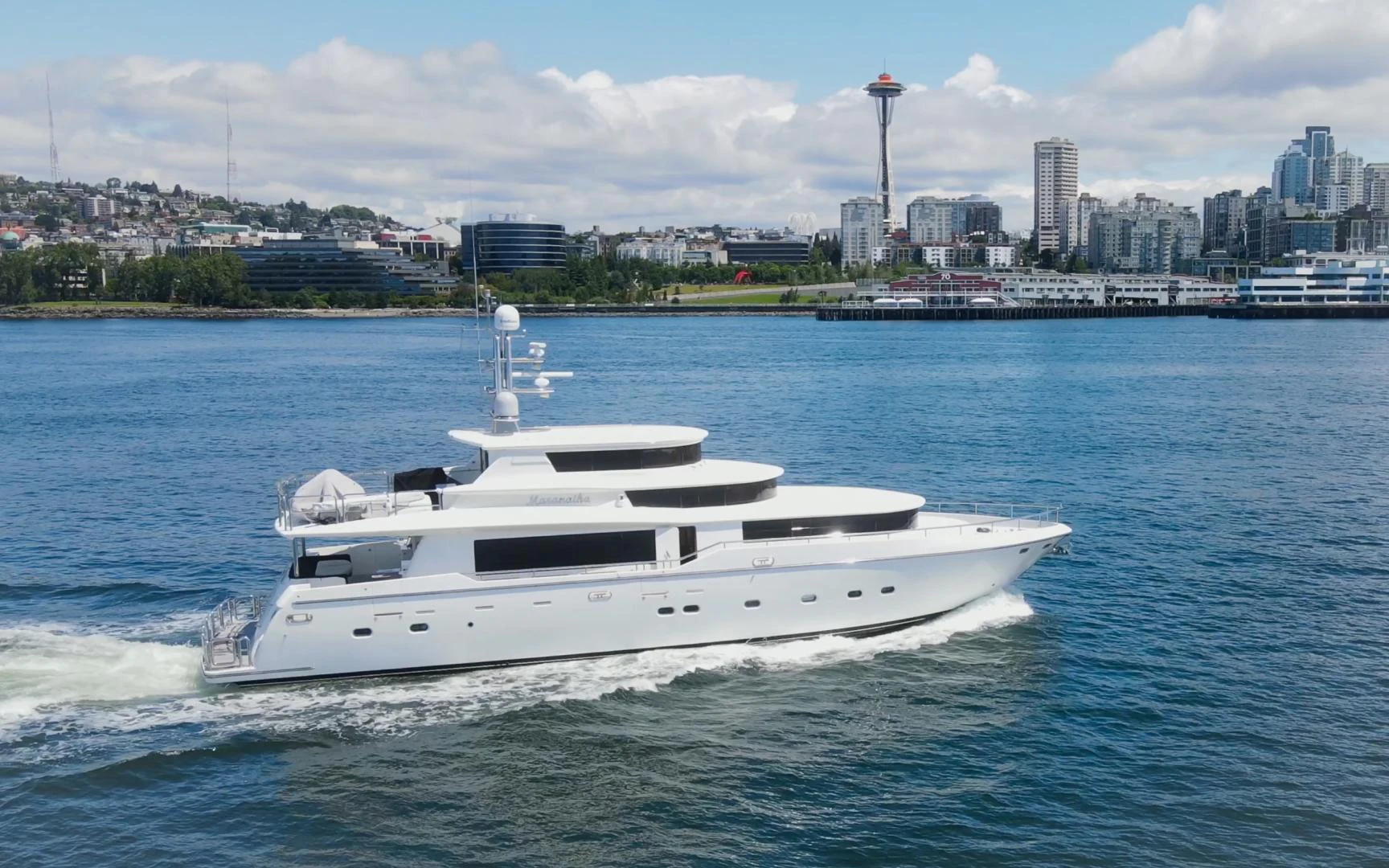 a white boat on the water aboard MARANATHA Yacht for Sale