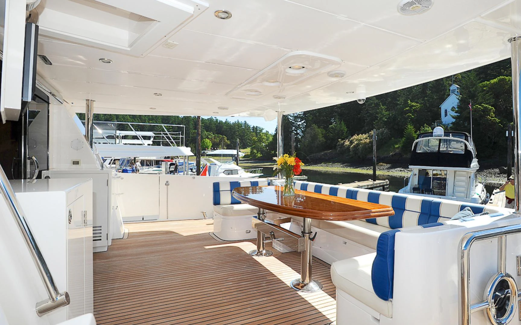 a room with a table and chairs aboard MARANATHA Yacht for Sale