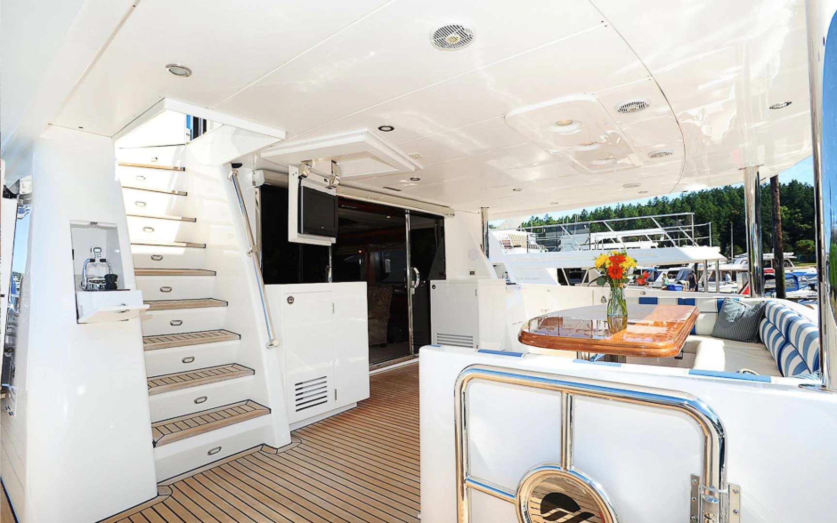 a room with a table and chairs aboard MARANATHA Yacht for Sale