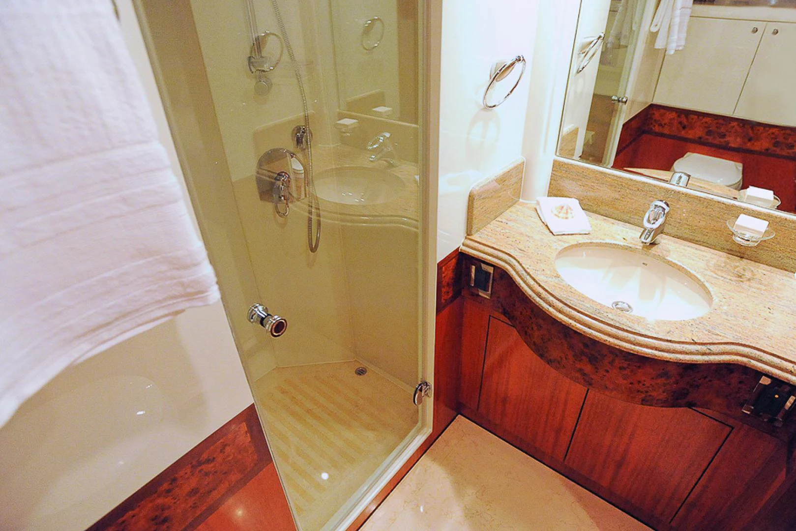 a bathroom with a sink and a bathtub aboard MARANATHA Yacht for Sale