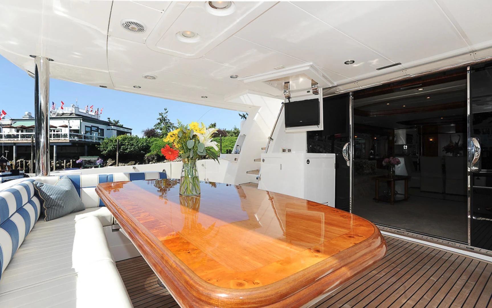 a table with flowers on it aboard MARANATHA Yacht for Sale