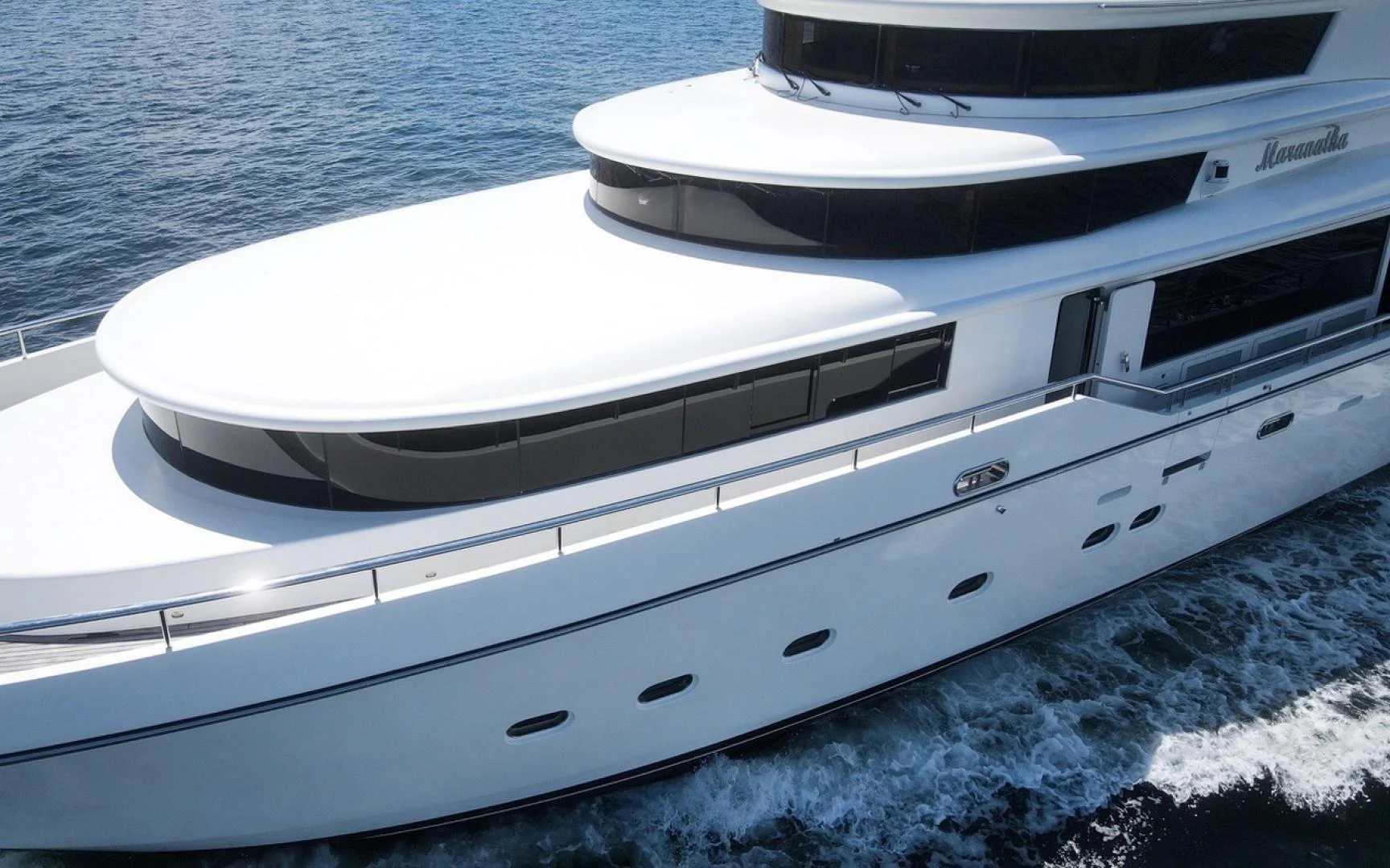 a white boat on the water aboard MARANATHA Yacht for Sale