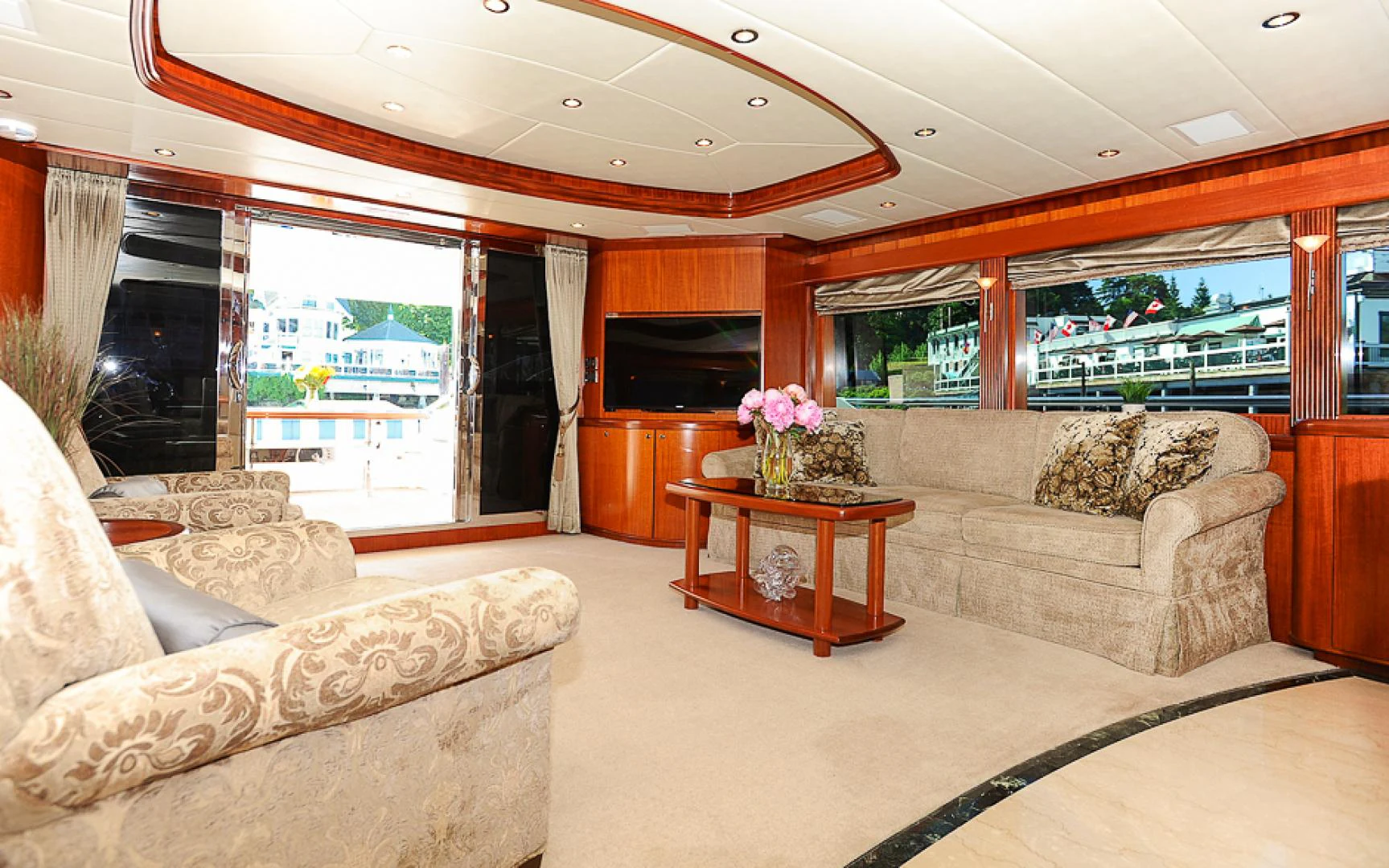 a living room with a large window aboard MARANATHA Yacht for Sale
