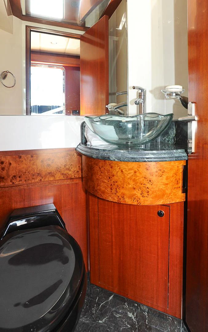 a sink and a washer in a bathroom aboard MARANATHA Yacht for Sale