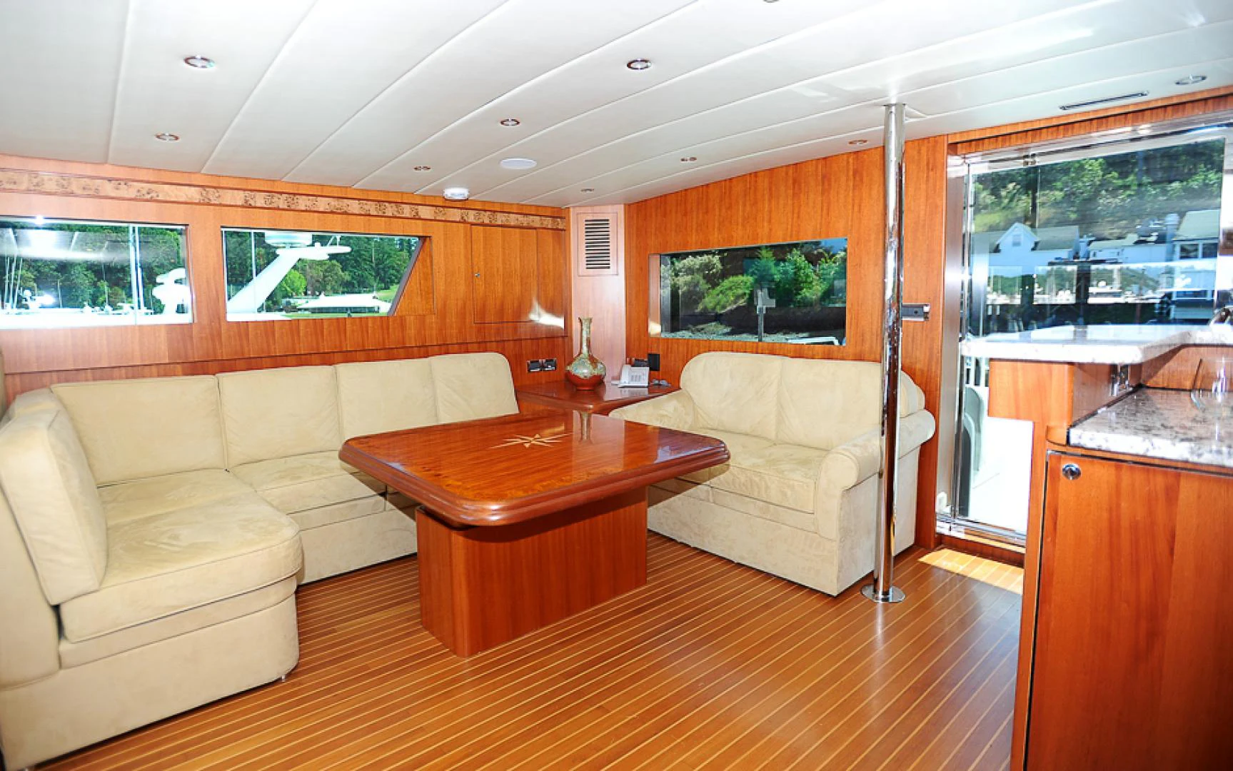 a living room with a table and couches aboard MARANATHA Yacht for Sale