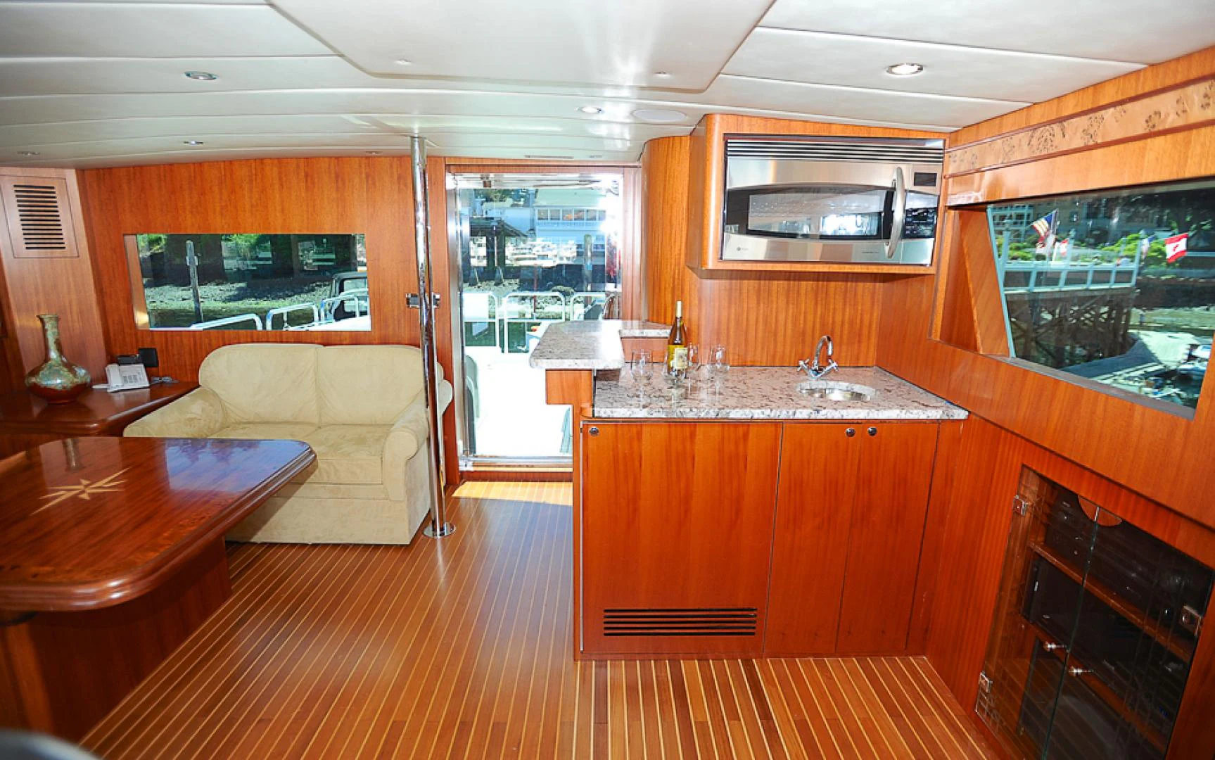 a kitchen with wooden cabinets aboard MARANATHA Yacht for Sale