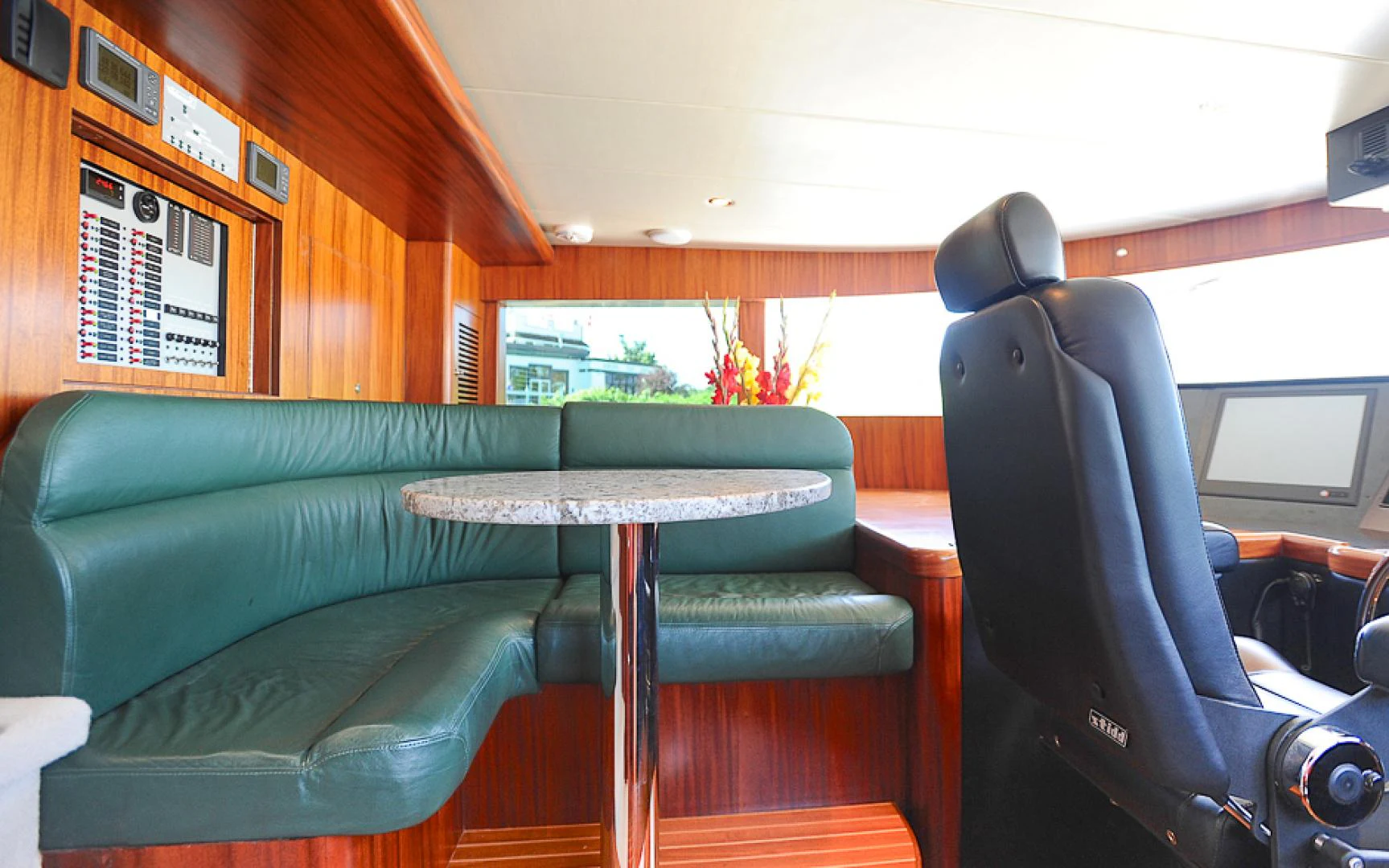 a table and chairs in a room aboard MARANATHA Yacht for Sale